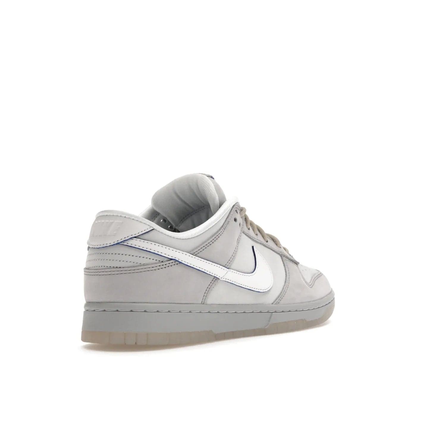 Nike Dunk Low Wolf Grey Pure Platinum - Image 32 - Only at www.BallersClubKickz.com - A timeless classic. The Nike Dunk Low Wolf Grey Pure Platinum combines wolf grey and pure platinum for a unique and eye-catching look. Available on August 15, 2022.