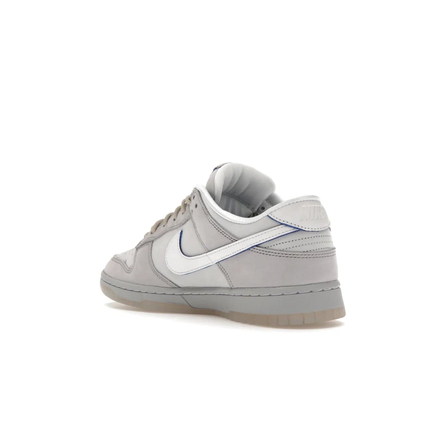 Nike Dunk Low Wolf Grey Pure Platinum - Image 24 - Only at www.BallersClubKickz.com - A timeless classic. The Nike Dunk Low Wolf Grey Pure Platinum combines wolf grey and pure platinum for a unique and eye-catching look. Available on August 15, 2022.