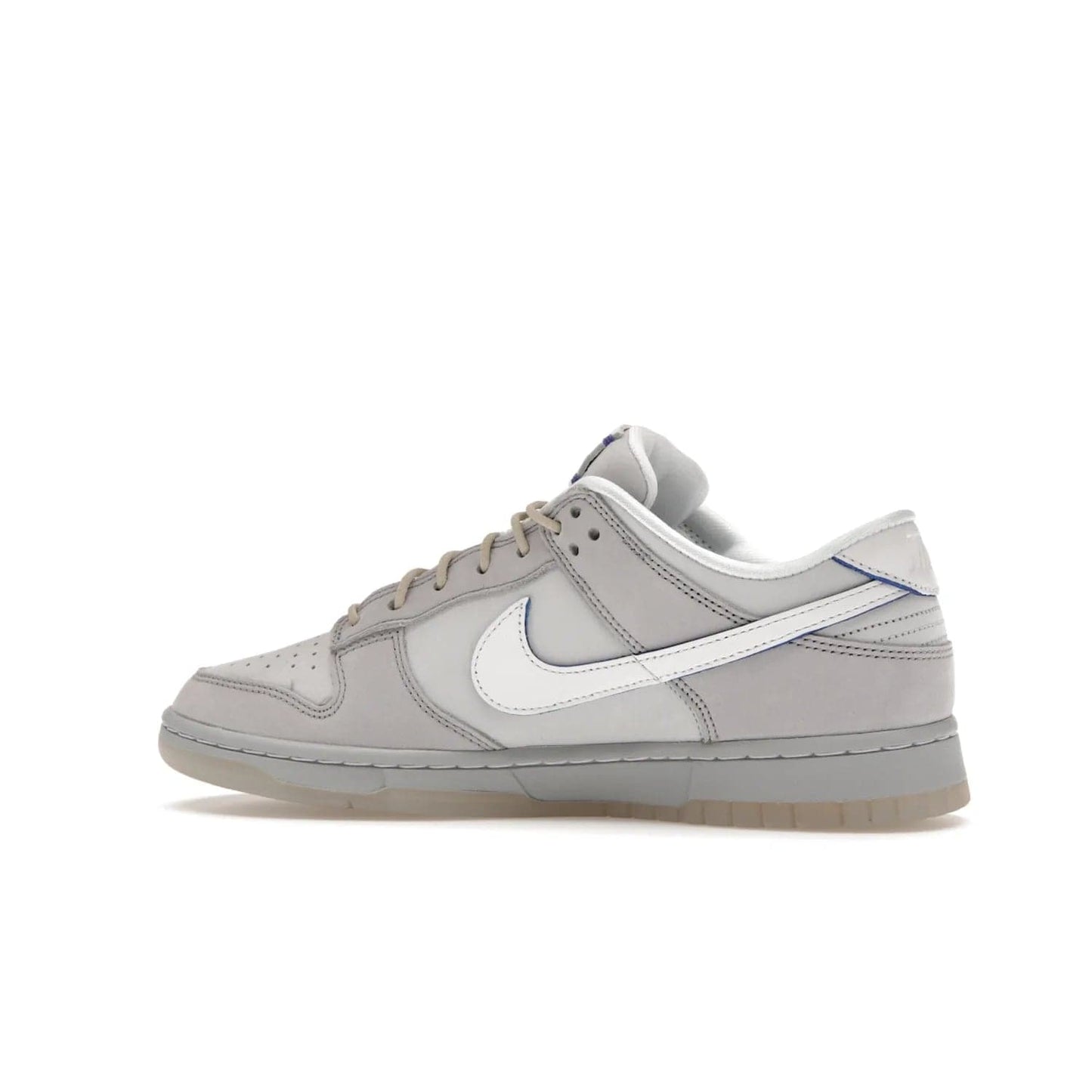 Nike Dunk Low Wolf Grey Pure Platinum - Image 21 - Only at www.BallersClubKickz.com - A timeless classic. The Nike Dunk Low Wolf Grey Pure Platinum combines wolf grey and pure platinum for a unique and eye-catching look. Available on August 15, 2022.