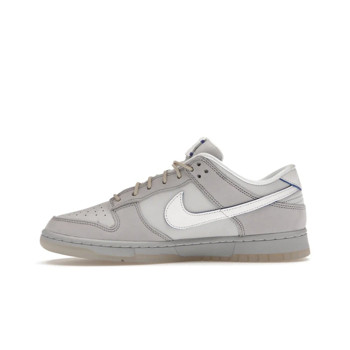 Nike Dunk Low Wolf Grey Pure Platinum - Image 19 - Only at www.BallersClubKickz.com - A timeless classic. The Nike Dunk Low Wolf Grey Pure Platinum combines wolf grey and pure platinum for a unique and eye-catching look. Available on August 15, 2022.