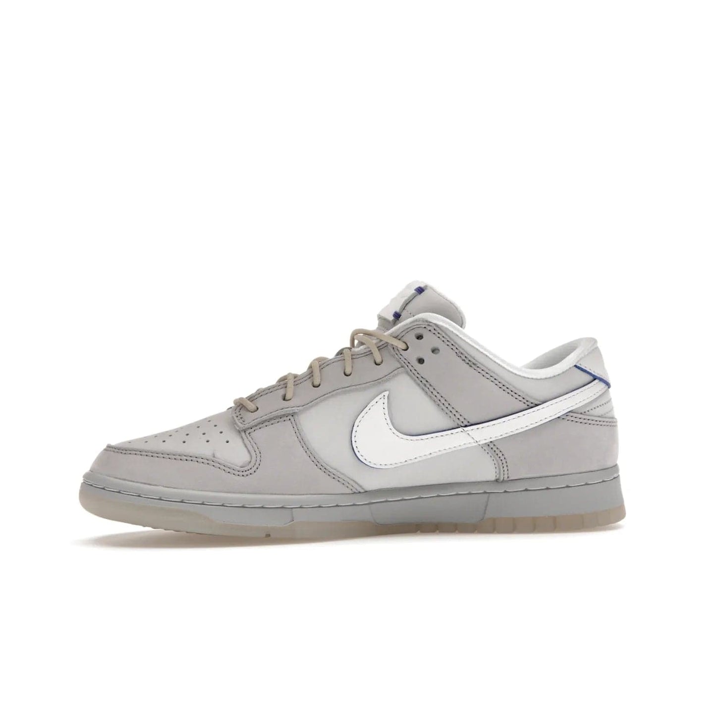 Nike Dunk Low Wolf Grey Pure Platinum - Image 18 - Only at www.BallersClubKickz.com - A timeless classic. The Nike Dunk Low Wolf Grey Pure Platinum combines wolf grey and pure platinum for a unique and eye-catching look. Available on August 15, 2022.