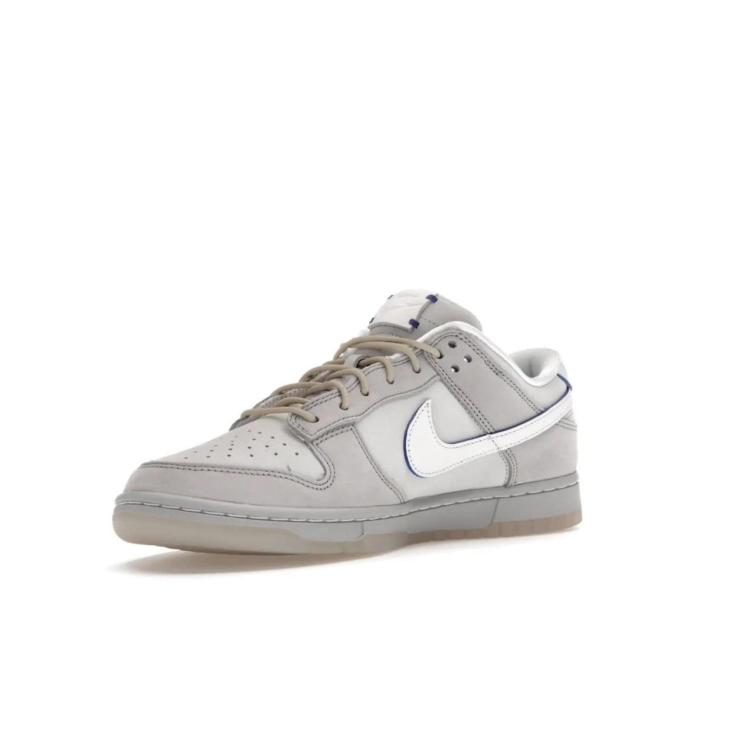 Nike Dunk Low Wolf Grey Pure Platinum - Image 15 - Only at www.BallersClubKickz.com - A timeless classic. The Nike Dunk Low Wolf Grey Pure Platinum combines wolf grey and pure platinum for a unique and eye-catching look. Available on August 15, 2022.