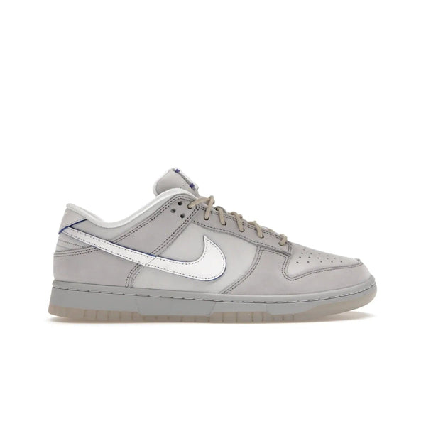 Nike Dunk Low Wolf Grey Pure Platinum - Image 1 - Only at www.BallersClubKickz.com - A timeless classic. The Nike Dunk Low Wolf Grey Pure Platinum combines wolf grey and pure platinum for a unique and eye-catching look. Available on August 15, 2022.
