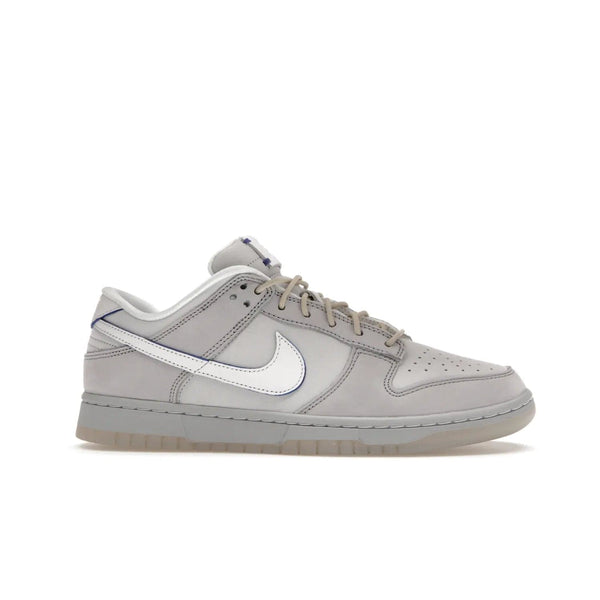 Nike Dunk Low Wolf Grey Pure Platinum - Image 2 - Only at www.BallersClubKickz.com - A timeless classic. The Nike Dunk Low Wolf Grey Pure Platinum combines wolf grey and pure platinum for a unique and eye-catching look. Available on August 15, 2022.