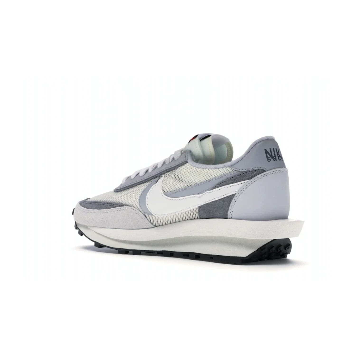 Nike LD Waffle sacai Summit White - Image 23 - Only at www.BallersClubKickz.com - Mesh fashion and comfort into your wardrobe with the Nike LD Waffle Sacai Summit White. Featuring a white upper, grey accents and overlapped white and grey Nike "Swoosh," these sneakers offer perfect balance of comfort and style. Perfect for office or a night out.