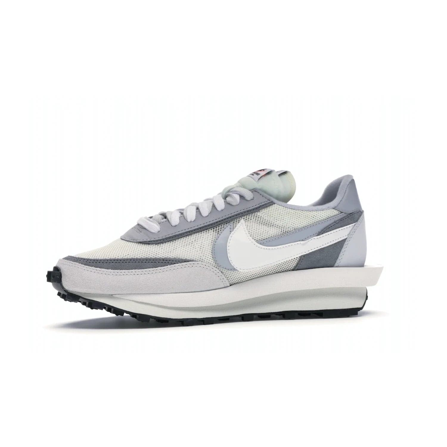 Nike LD Waffle sacai Summit White - Image 17 - Only at www.BallersClubKickz.com - Mesh fashion and comfort into your wardrobe with the Nike LD Waffle Sacai Summit White. Featuring a white upper, grey accents and overlapped white and grey Nike "Swoosh," these sneakers offer perfect balance of comfort and style. Perfect for office or a night out.