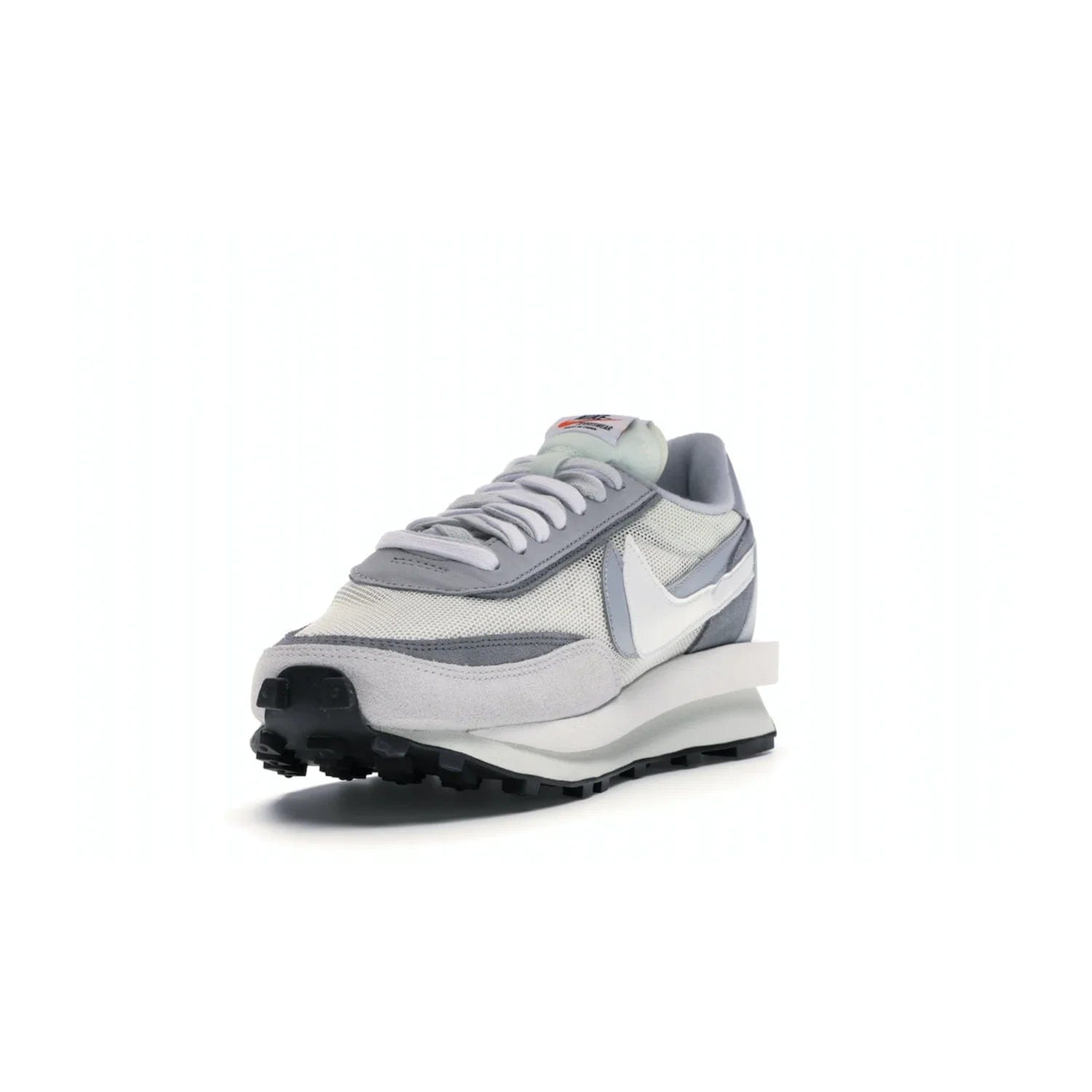 Nike LD Waffle sacai Summit White - Image 13 - Only at www.BallersClubKickz.com - Mesh fashion and comfort into your wardrobe with the Nike LD Waffle Sacai Summit White. Featuring a white upper, grey accents and overlapped white and grey Nike "Swoosh," these sneakers offer perfect balance of comfort and style. Perfect for office or a night out.