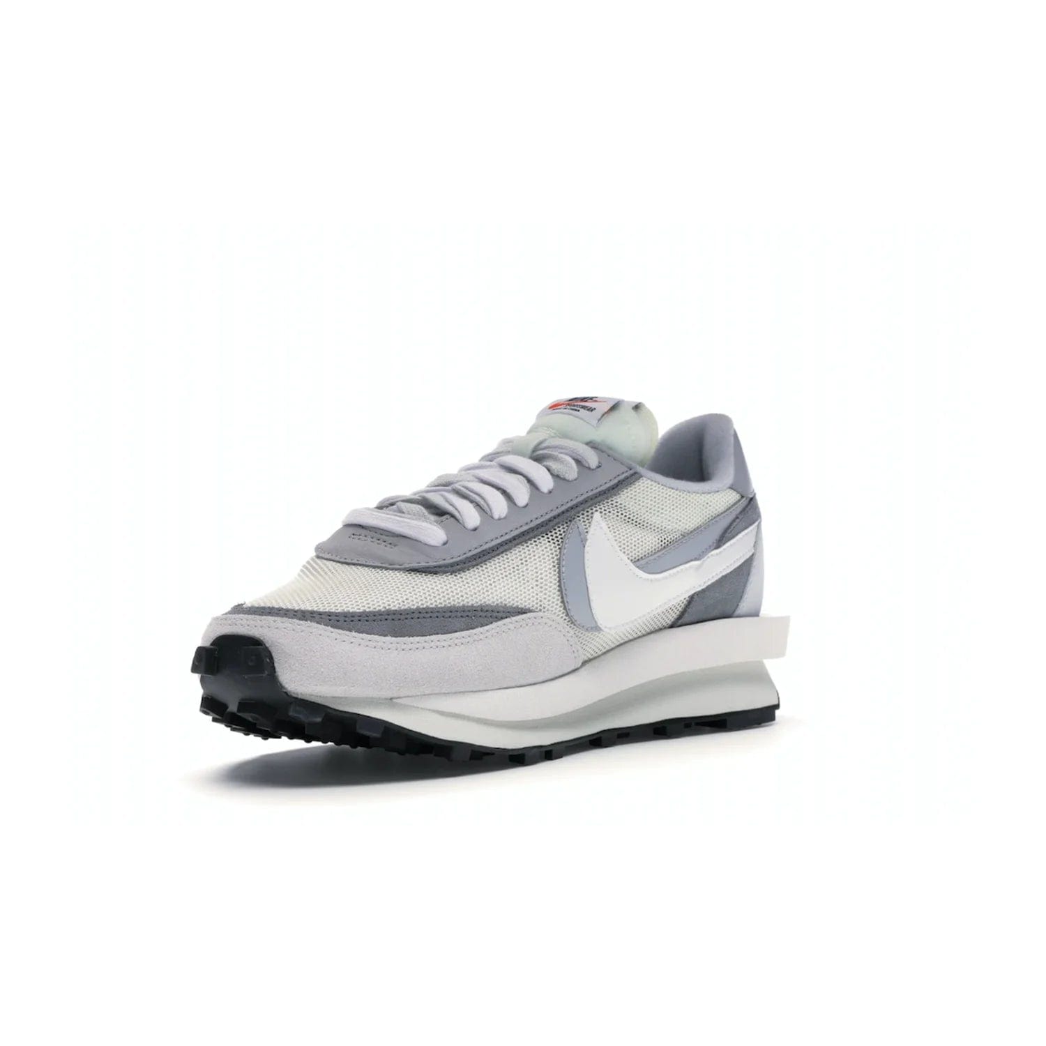 Nike LD Waffle sacai Summit White - Image 14 - Only at www.BallersClubKickz.com - Mesh fashion and comfort into your wardrobe with the Nike LD Waffle Sacai Summit White. Featuring a white upper, grey accents and overlapped white and grey Nike "Swoosh," these sneakers offer perfect balance of comfort and style. Perfect for office or a night out.