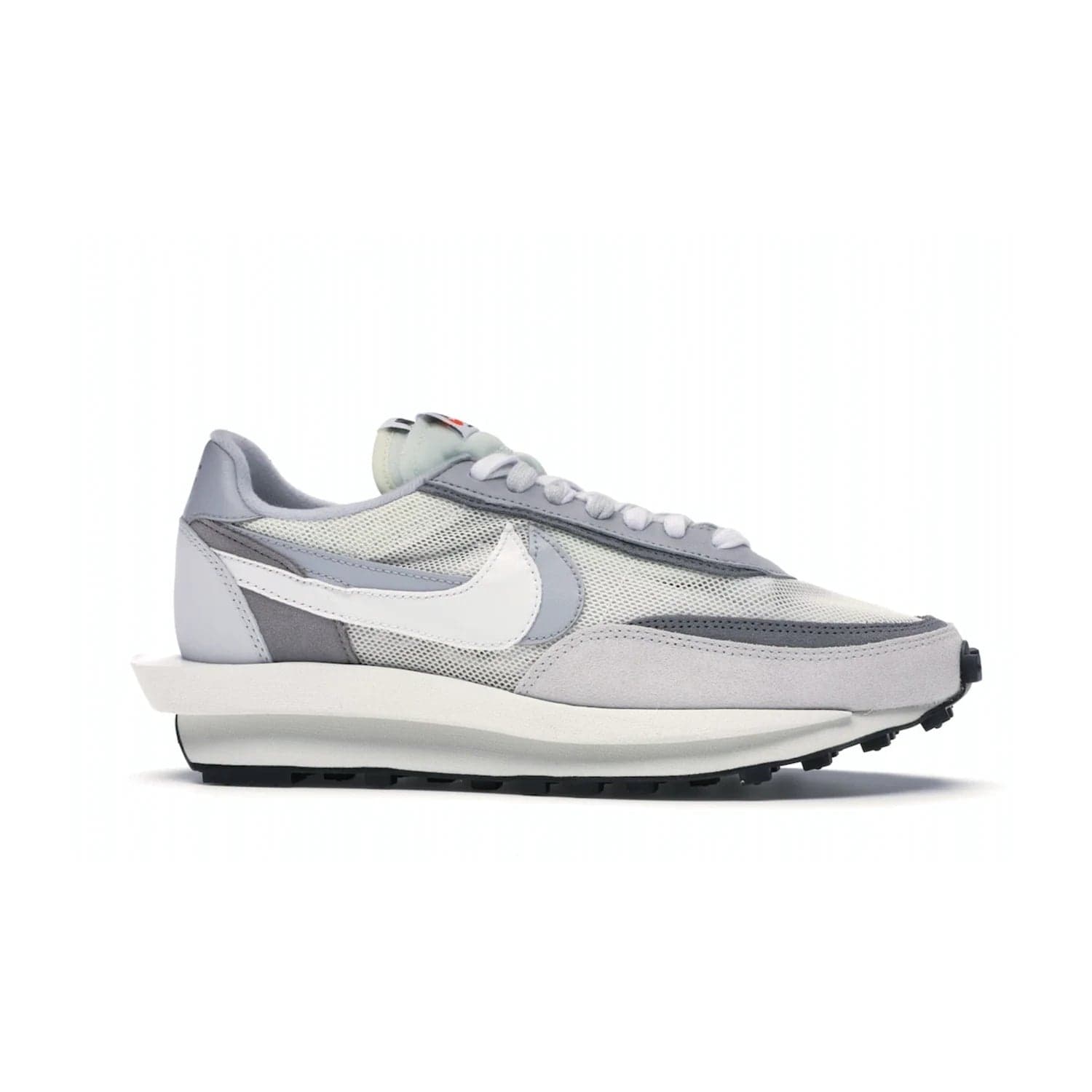 Nike LD Waffle sacai Summit White - Image 2 - Only at www.BallersClubKickz.com - Mesh fashion and comfort into your wardrobe with the Nike LD Waffle Sacai Summit White. Featuring a white upper, grey accents and overlapped white and grey Nike "Swoosh," these sneakers offer perfect balance of comfort and style. Perfect for office or a night out.