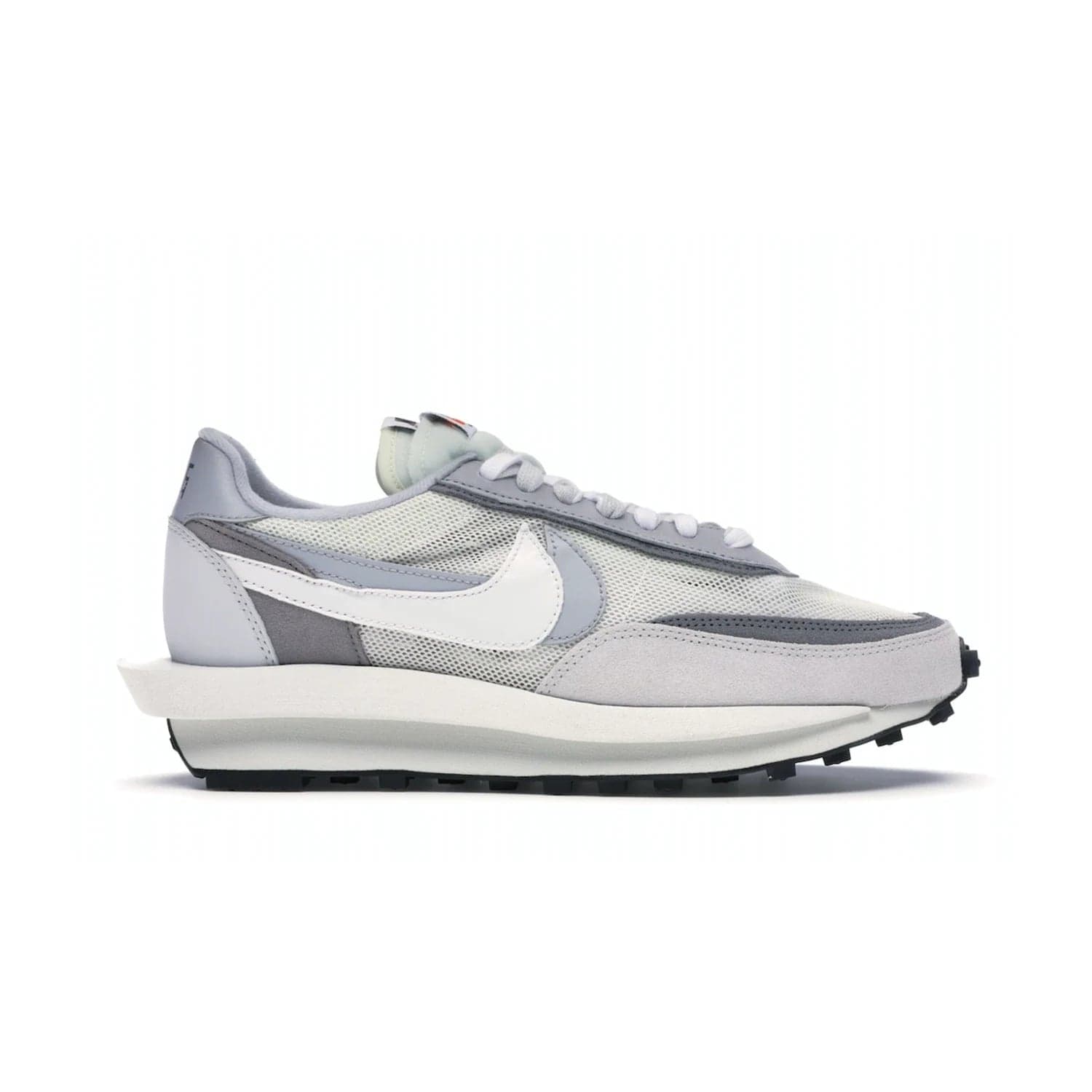 Nike LD Waffle sacai Summit White - Image 1 - Only at www.BallersClubKickz.com - Mesh fashion and comfort into your wardrobe with the Nike LD Waffle Sacai Summit White. Featuring a white upper, grey accents and overlapped white and grey Nike "Swoosh," these sneakers offer perfect balance of comfort and style. Perfect for office or a night out.