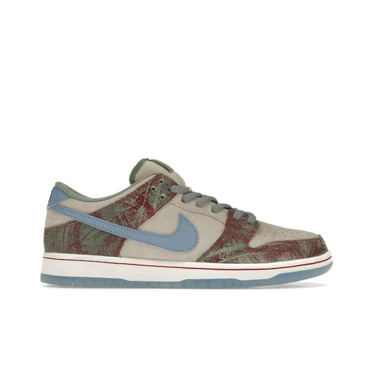 Nike SB Dunk Low Crenshaw Skate Club - Image 1 - Only at www.BallersClubKickz.com - Introducing the Nike SB Dunk Low Crenshaw Skate Club! Classic skate shoes with Sail and Light Blue upper, Cedar accents, padded collars and superior grip for comfortable, stable performance and style. Ideal for any skate session.