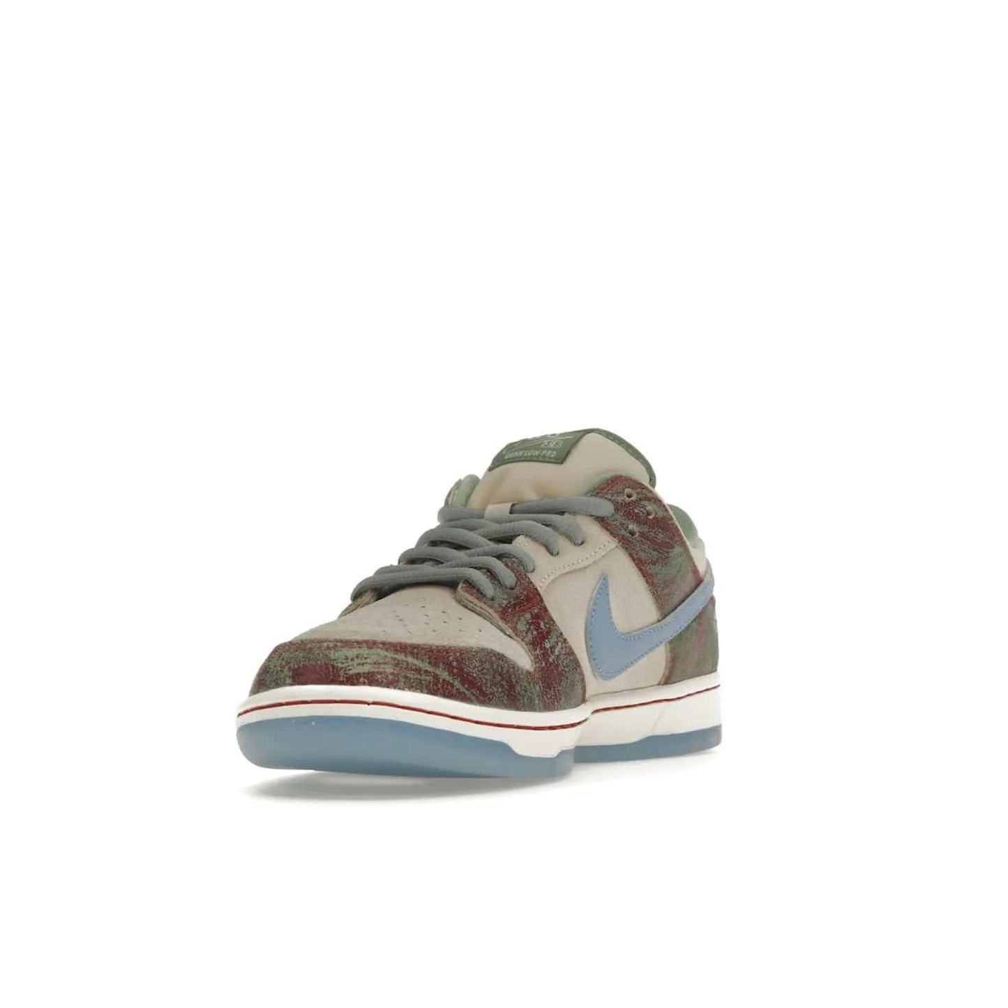Nike SB Dunk Low Crenshaw Skate Club - Image 13 - Only at www.BallersClubKickz.com - Introducing the Nike SB Dunk Low Crenshaw Skate Club! Classic skate shoes with Sail and Light Blue upper, Cedar accents, padded collars and superior grip for comfortable, stable performance and style. Ideal for any skate session.