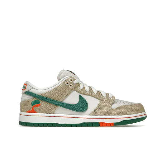 Nike SB Dunk Low Jarritos - Image 1 - Only at www.BallersClubKickz.com - Shop limited edition Nike SB Dunk Low Jarritos! Crafted with white leather and tear-away canvas materials with green accents. Includes orange, green, and white laces to customize your look. Available now.