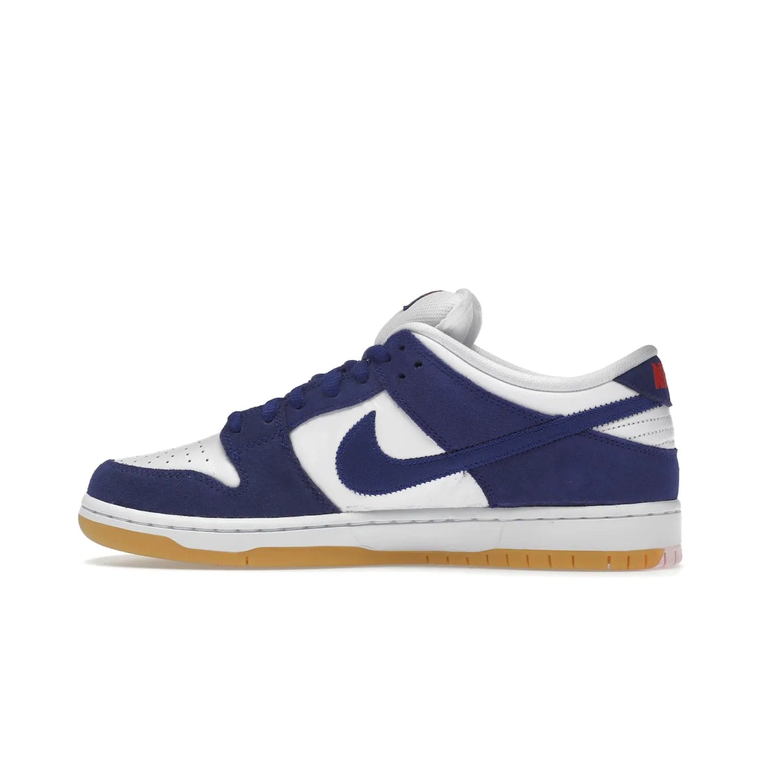 Nike SB Dunk Low Los Angeles Dodgers - Image 20 - Only at www.BallersClubKickz.com - Make a statement with the limited edition Nike SB Dunk Low Los Angeles Dodgers. Featuring a striking blue and white color combination, convenient lace-up closure, light-brown sole, and pink graphic, this stylish and comfortable low-top sneaker is perfect for sport fans and sneaker enthusiasts alike. Available in June 2022.