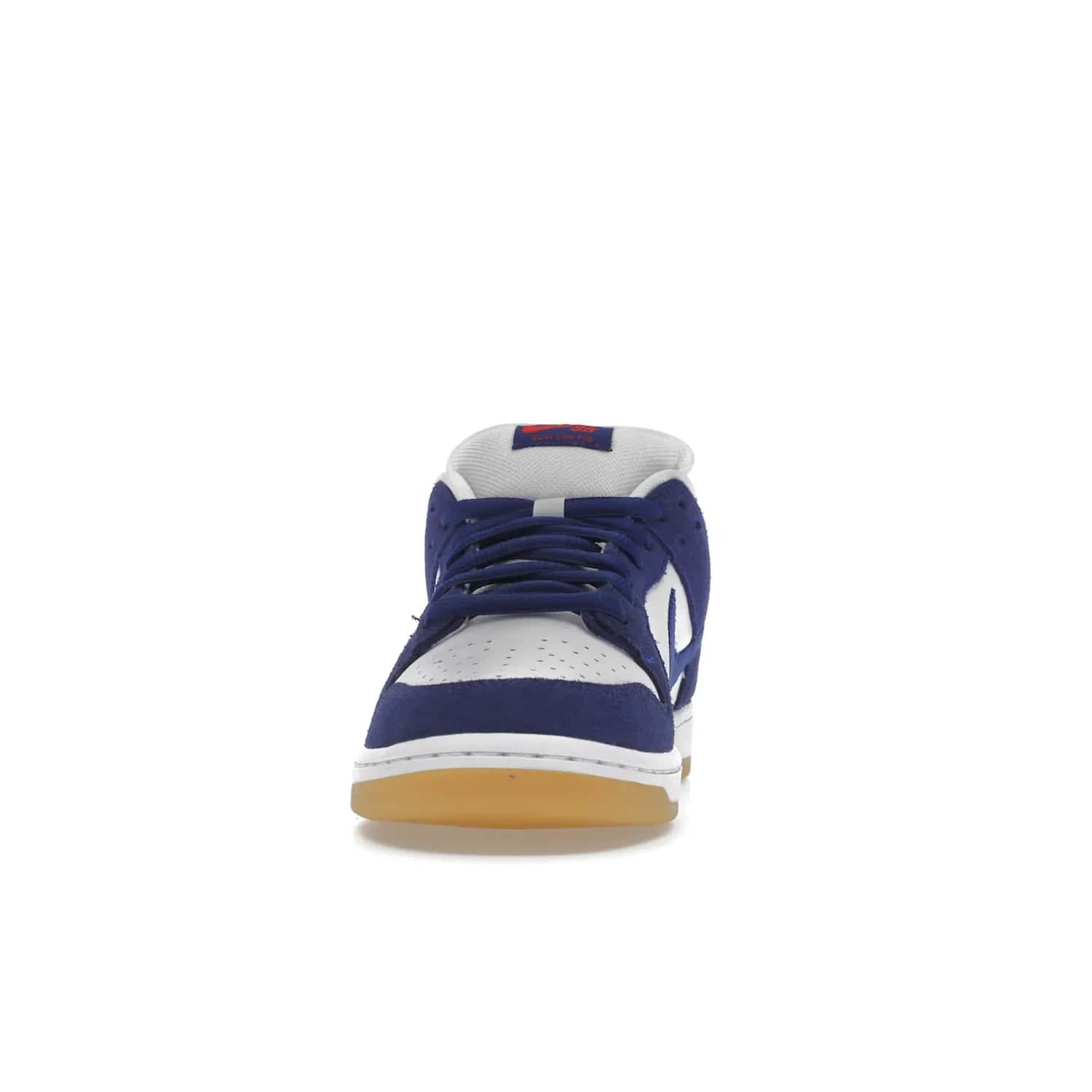 Nike SB Dunk Low Los Angeles Dodgers - Image 11 - Only at www.BallersClubKickz.com - Make a statement with the limited edition Nike SB Dunk Low Los Angeles Dodgers. Featuring a striking blue and white color combination, convenient lace-up closure, light-brown sole, and pink graphic, this stylish and comfortable low-top sneaker is perfect for sport fans and sneaker enthusiasts alike. Available in June 2022.