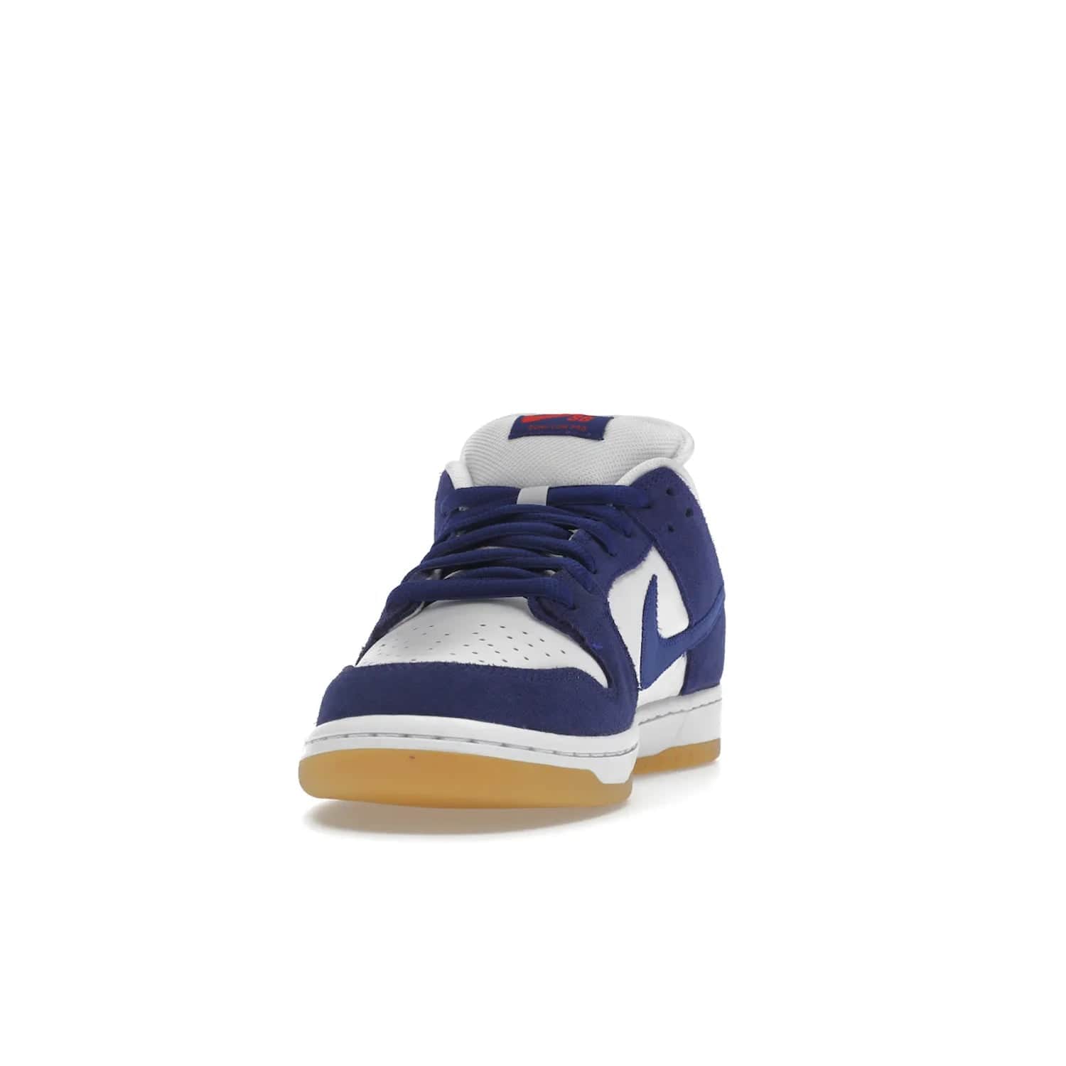 Nike SB Dunk Low Los Angeles Dodgers - Image 12 - Only at www.BallersClubKickz.com - Make a statement with the limited edition Nike SB Dunk Low Los Angeles Dodgers. Featuring a striking blue and white color combination, convenient lace-up closure, light-brown sole, and pink graphic, this stylish and comfortable low-top sneaker is perfect for sport fans and sneaker enthusiasts alike. Available in June 2022.