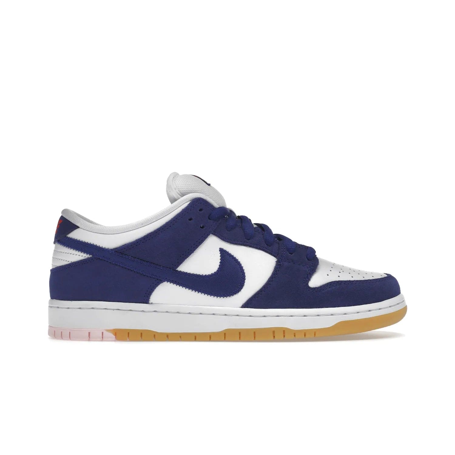 Nike SB Dunk Low Los Angeles Dodgers - Image 1 - Only at www.BallersClubKickz.com - Make a statement with the limited edition Nike SB Dunk Low Los Angeles Dodgers. Featuring a striking blue and white color combination, convenient lace-up closure, light-brown sole, and pink graphic, this stylish and comfortable low-top sneaker is perfect for sport fans and sneaker enthusiasts alike. Available in June 2022.