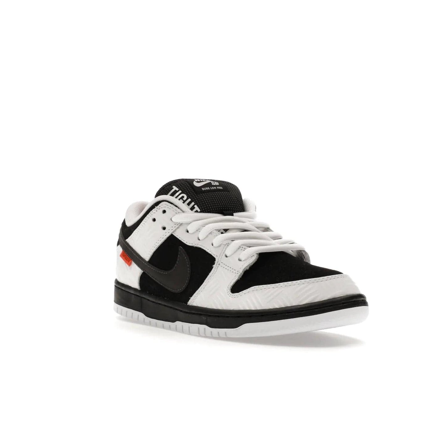 Nike SB Dunk Low TIGHTBOOTH - Image 6 - Only at www.BallersClubKickz.com - Releasing Nov 14, 2023, the TIGHTBOOTH Nike SB Dunk Low celebrates street skating and the urban streets. The White/Black-Safety Orange hue captures the energy and feel of the board and provides superior performance and bold style. Be ready to take on the black of night and make your mark on street culture.