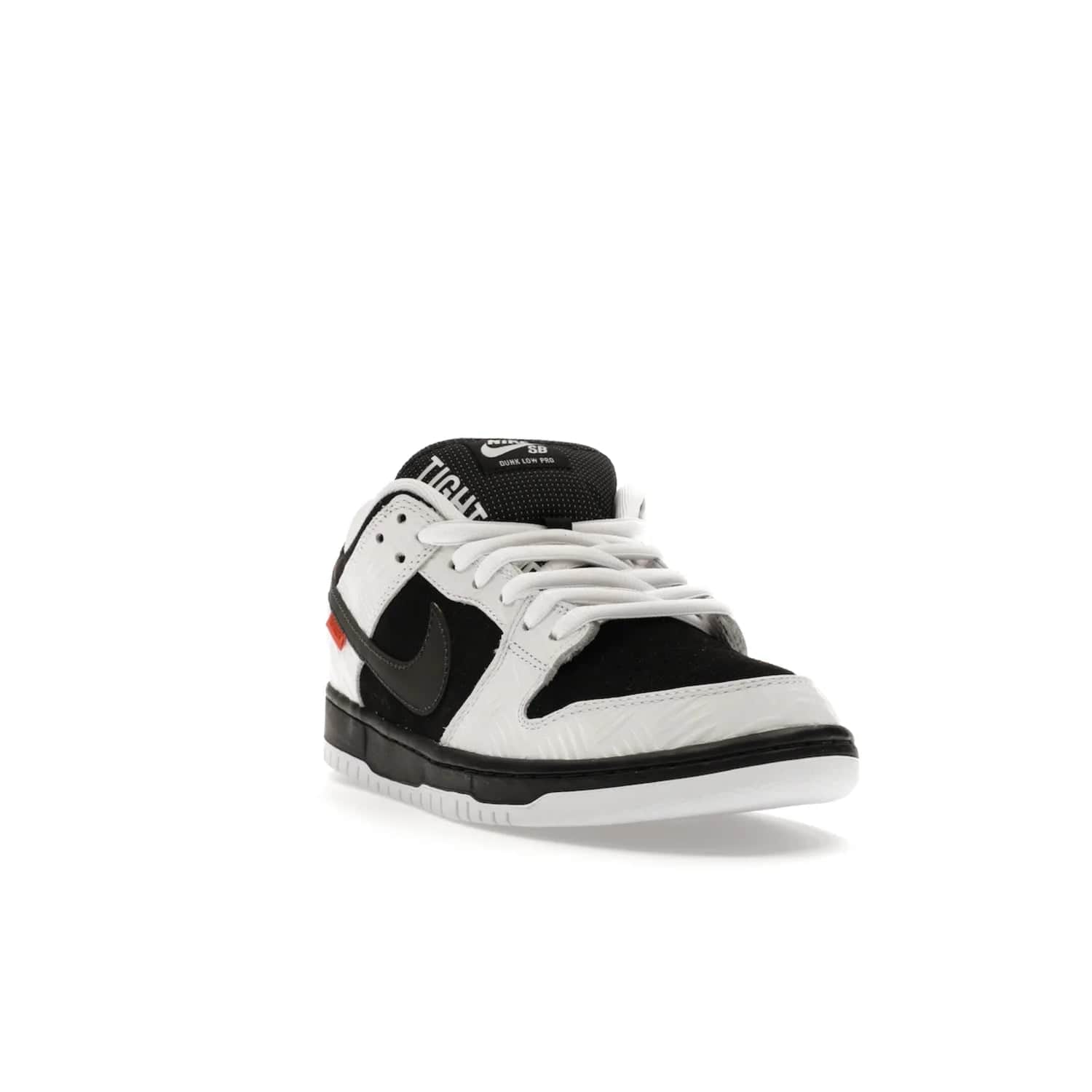Nike SB Dunk Low TIGHTBOOTH - Image 7 - Only at www.BallersClubKickz.com - Releasing Nov 14, 2023, the TIGHTBOOTH Nike SB Dunk Low celebrates street skating and the urban streets. The White/Black-Safety Orange hue captures the energy and feel of the board and provides superior performance and bold style. Be ready to take on the black of night and make your mark on street culture.