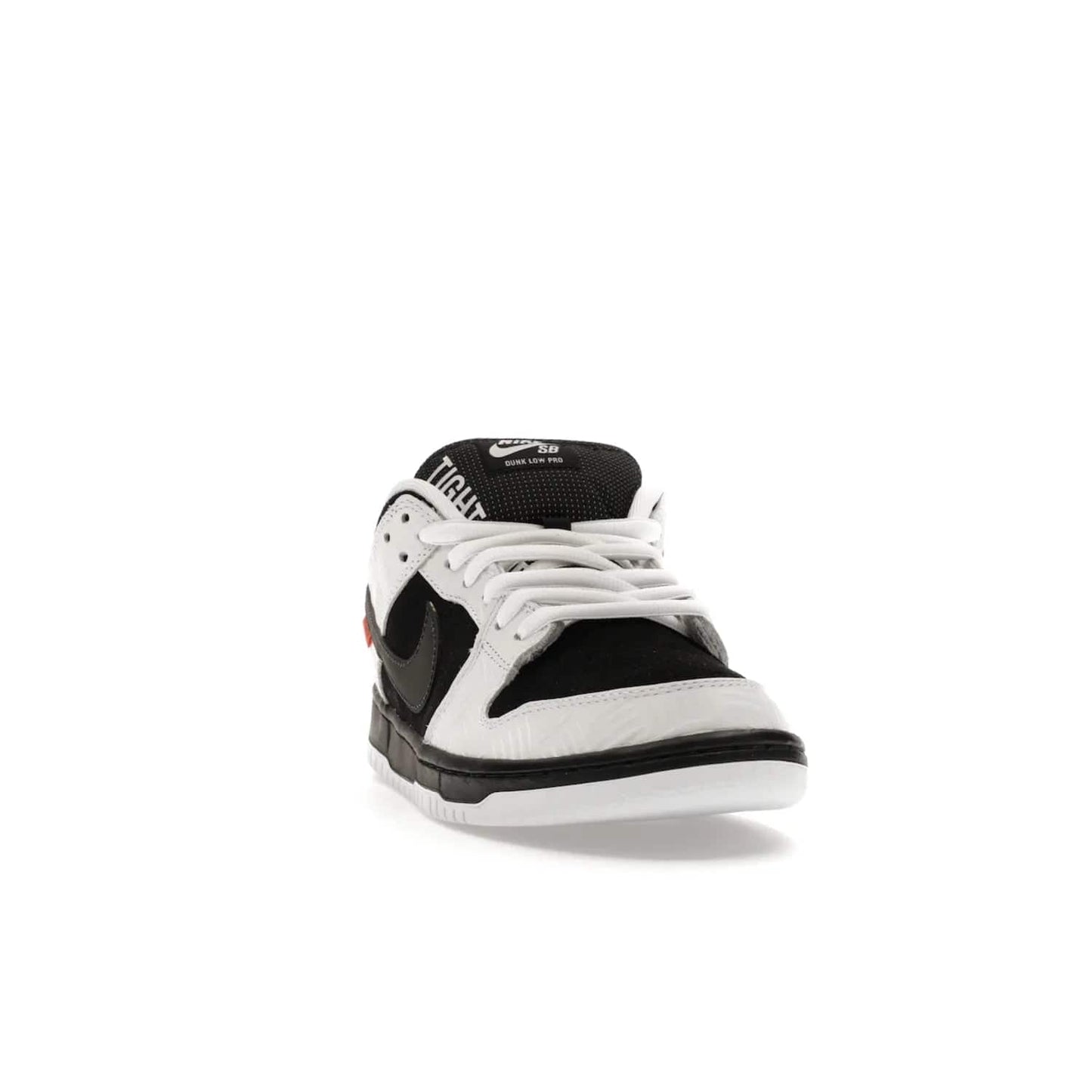 Nike SB Dunk Low TIGHTBOOTH - Image 8 - Only at www.BallersClubKickz.com - Releasing Nov 14, 2023, the TIGHTBOOTH Nike SB Dunk Low celebrates street skating and the urban streets. The White/Black-Safety Orange hue captures the energy and feel of the board and provides superior performance and bold style. Be ready to take on the black of night and make your mark on street culture.