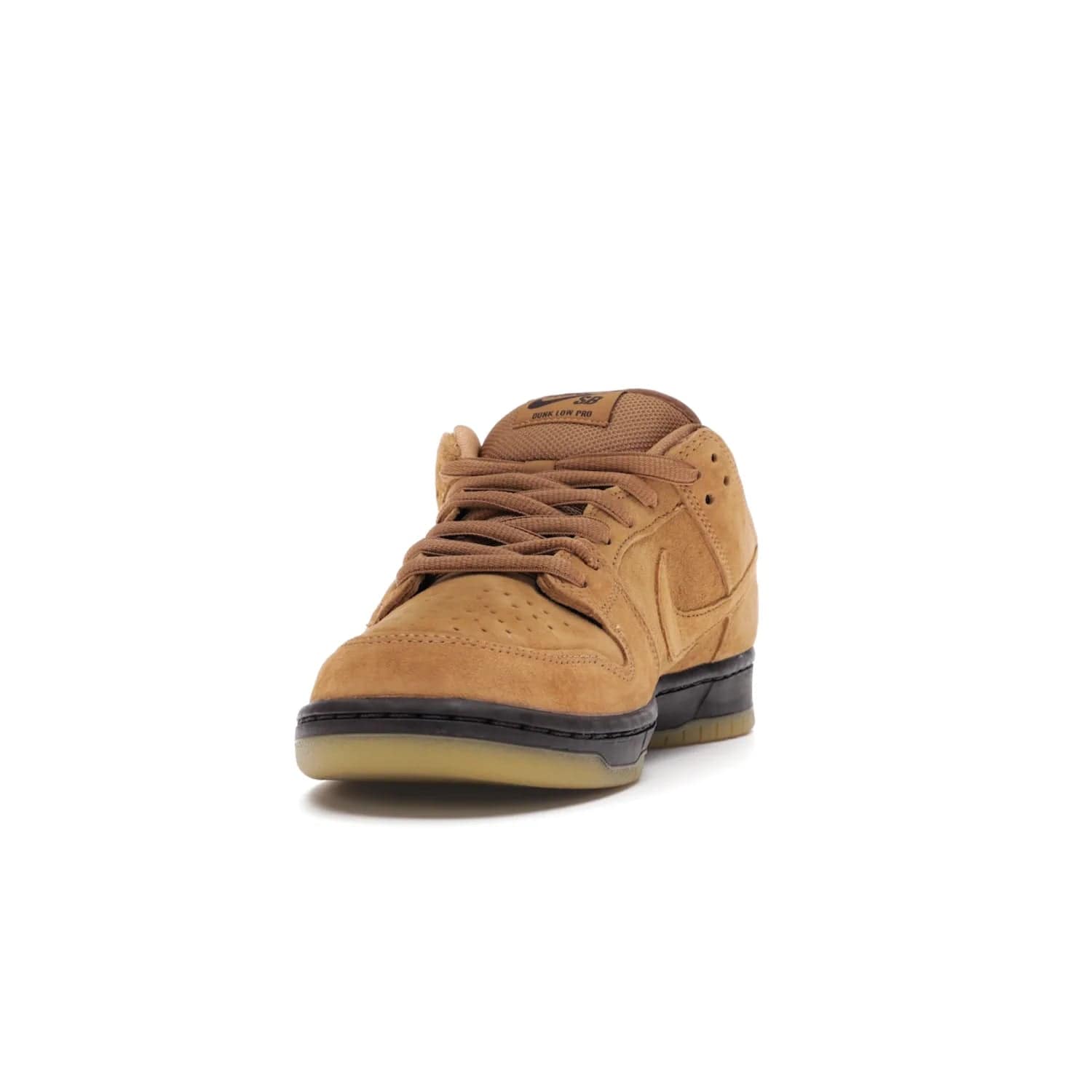 Nike SB Dunk Low Wheat (2021/2023) - Image 12 - Only at www.BallersClubKickz.com - The Nike SB Dunk Low Wheat (2021/2023)has a sleek silhouette and wheat suede upper. Tan tones for lining, mesh tongues, and laces. Iconic color palette midsole, perforated boxing toe. Brown branding on tongue and heel. Gum rubber outsole with partitioned pattern for traction. Eschewed in Feb 2021 for $110.
