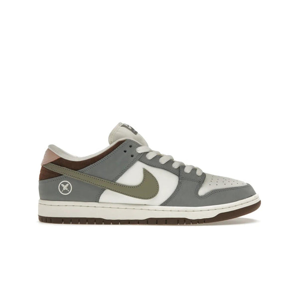 Nike SB Dunk Low Yuto Horigome - Image 1 - Only at www.BallersClubKickz.com - Introducing the Nike SB Dunk Low Yuto Horigome! Co-designed with the skater himself, it features Wolf Grey, Iron Grey, and Sail accents. Comfort and style for everyday wear, plus perfect for skate sessions. Get yours August 29, 2023!