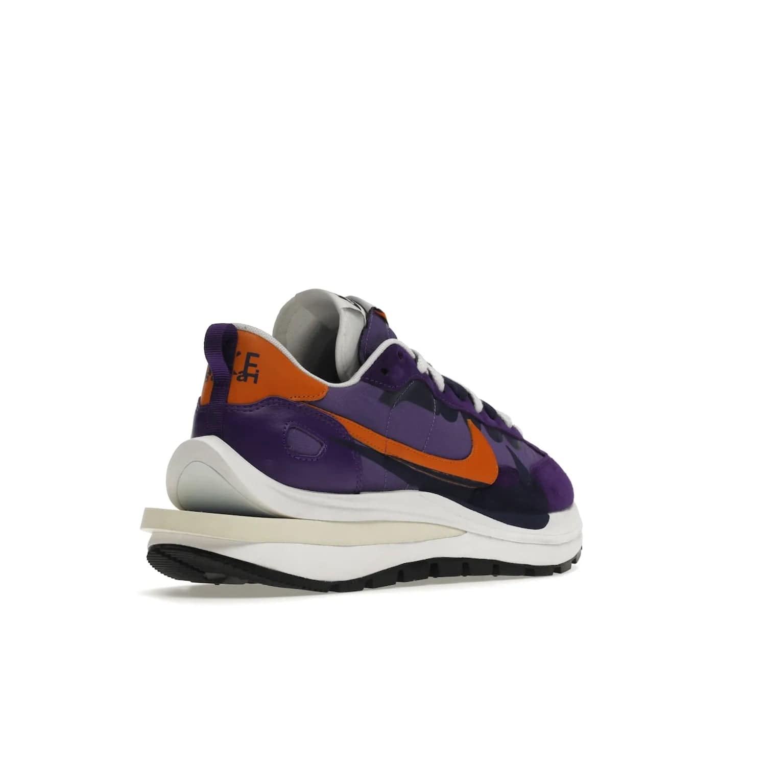 Nike Vaporwaffle sacai Dark Iris - Image 32 - Only at www.BallersClubKickz.com - Unique Nike Vaporwaffle sacai Dark Iris collab. Suede, leather & textile upper with Orange accents. Dual tongues & midsoles. Woven labels & heel tabs branding. Colorway of Purple, Orange, White & Black. Must-have for any wardrobe.