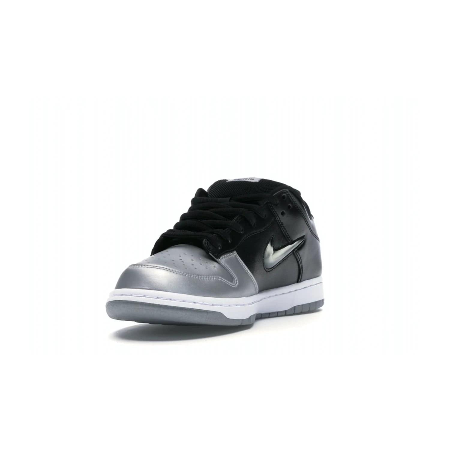 Nike SB Dunk Low Supreme Jewel Swoosh Silver - Image 13 - Only at www.BallersClubKickz.com - This Metallic Silver/Metallic Silver-Black Nike SB Dunk Low Supreme Jewel Swoosh Silver brings a flashy design to the iconic SB Dunk. Released in 2019, this is a must-have for any collection.