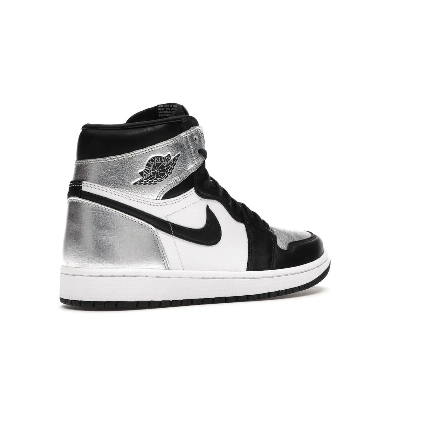 Jordan 1 Retro High Silver Toe (Women's) - Image 33 - Only at www.BallersClubKickz.com - Introducing the Jordan 1 Retro High Silver Toe (Women's): an updated spin on the iconic 'Black Toe' theme. Featuring white & black leather and silver patent leather construction. Nike Air branding, Air Jordan Wings logo, and white/black sole finish give a classic look. The perfect addition to an on-trend streetwear look. Available in classic black & white, this Jordan 1 is an instant classic. Released in February 20