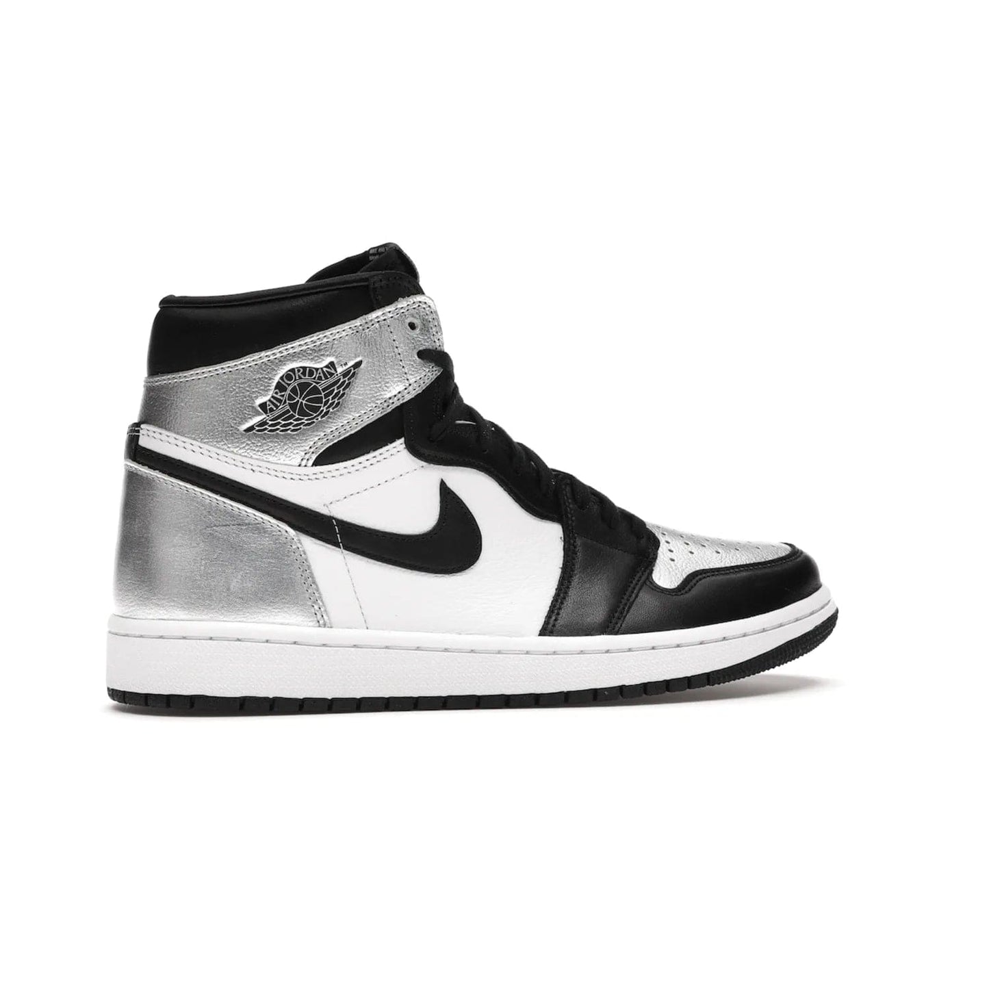 Jordan 1 Retro High Silver Toe (Women's) - Image 35 - Only at www.BallersClubKickz.com - Introducing the Jordan 1 Retro High Silver Toe (Women's): an updated spin on the iconic 'Black Toe' theme. Featuring white & black leather and silver patent leather construction. Nike Air branding, Air Jordan Wings logo, and white/black sole finish give a classic look. The perfect addition to an on-trend streetwear look. Available in classic black & white, this Jordan 1 is an instant classic. Released in February 20