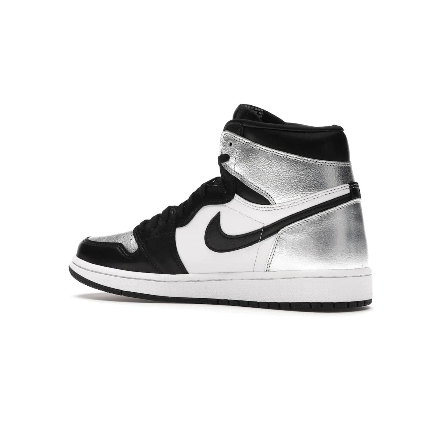 Jordan 1 Retro High Silver Toe (Women's) - Image 22 - Only at www.BallersClubKickz.com - Introducing the Jordan 1 Retro High Silver Toe (Women's): an updated spin on the iconic 'Black Toe' theme. Featuring white & black leather and silver patent leather construction. Nike Air branding, Air Jordan Wings logo, and white/black sole finish give a classic look. The perfect addition to an on-trend streetwear look. Available in classic black & white, this Jordan 1 is an instant classic. Released in February 20