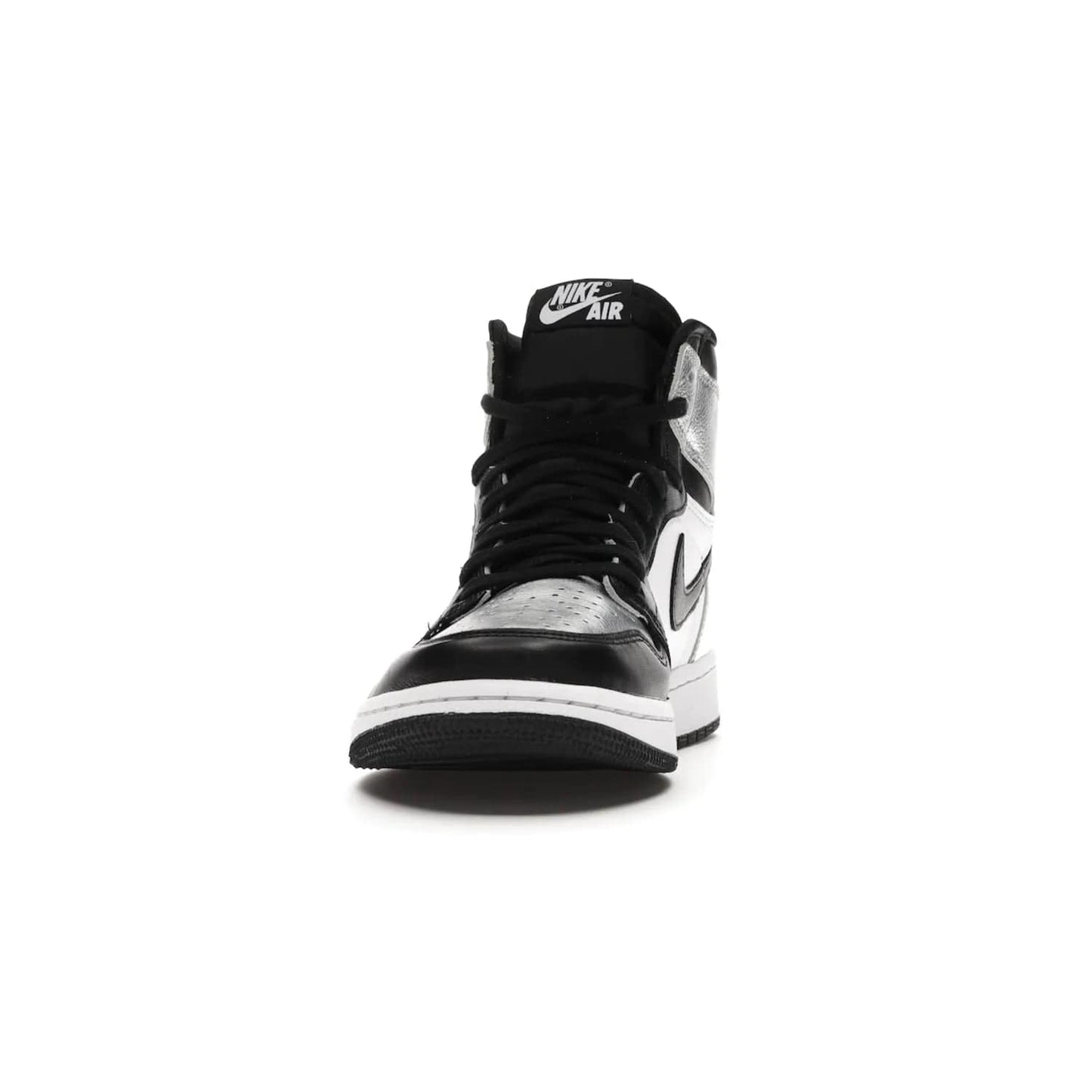 Jordan 1 Retro High Silver Toe (Women's) - Image 11 - Only at www.BallersClubKickz.com - Introducing the Jordan 1 Retro High Silver Toe (Women's): an updated spin on the iconic 'Black Toe' theme. Featuring white & black leather and silver patent leather construction. Nike Air branding, Air Jordan Wings logo, and white/black sole finish give a classic look. The perfect addition to an on-trend streetwear look. Available in classic black & white, this Jordan 1 is an instant classic. Released in February 20