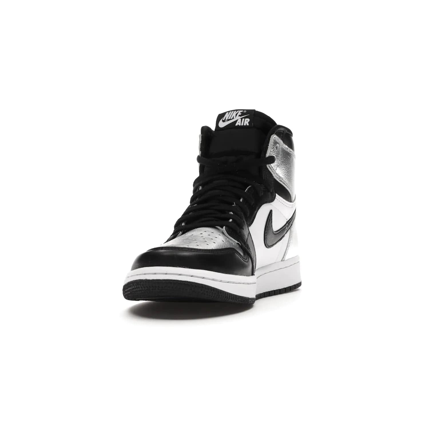 Jordan 1 Retro High Silver Toe (Women's) - Image 12 - Only at www.BallersClubKickz.com - Introducing the Jordan 1 Retro High Silver Toe (Women's): an updated spin on the iconic 'Black Toe' theme. Featuring white & black leather and silver patent leather construction. Nike Air branding, Air Jordan Wings logo, and white/black sole finish give a classic look. The perfect addition to an on-trend streetwear look. Available in classic black & white, this Jordan 1 is an instant classic. Released in February 20