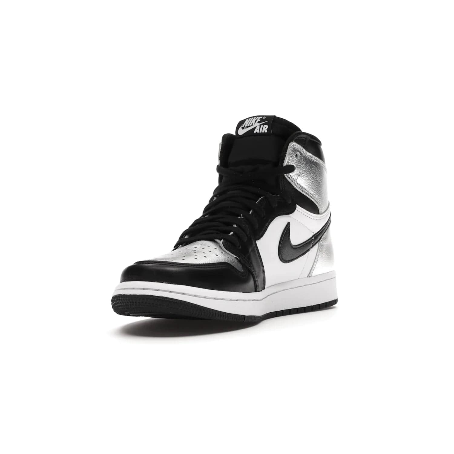 Jordan 1 Retro High Silver Toe (Women's) - Image 13 - Only at www.BallersClubKickz.com - Introducing the Jordan 1 Retro High Silver Toe (Women's): an updated spin on the iconic 'Black Toe' theme. Featuring white & black leather and silver patent leather construction. Nike Air branding, Air Jordan Wings logo, and white/black sole finish give a classic look. The perfect addition to an on-trend streetwear look. Available in classic black & white, this Jordan 1 is an instant classic. Released in February 20