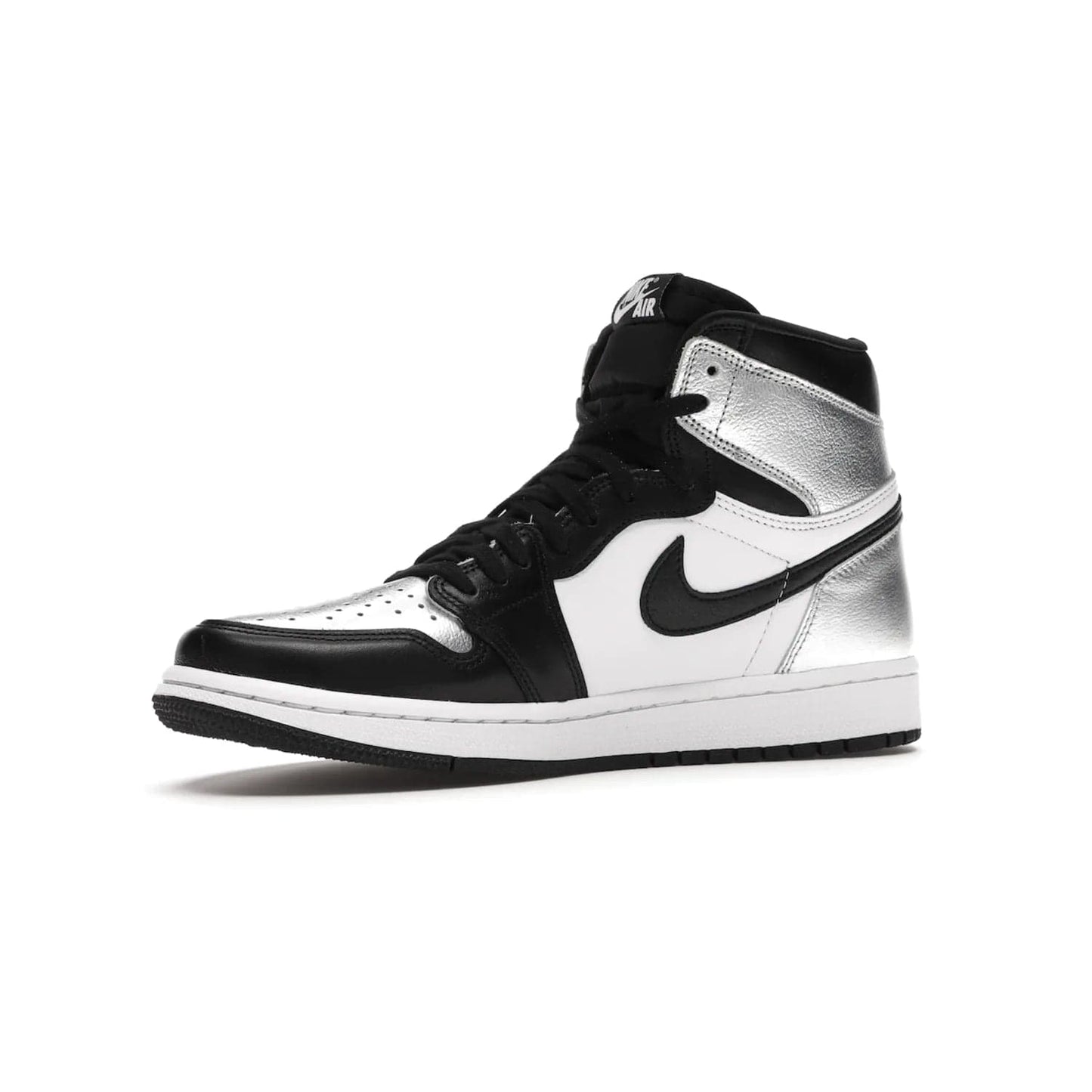 Jordan 1 Retro High Silver Toe (Women's) - Image 16 - Only at www.BallersClubKickz.com - Introducing the Jordan 1 Retro High Silver Toe (Women's): an updated spin on the iconic 'Black Toe' theme. Featuring white & black leather and silver patent leather construction. Nike Air branding, Air Jordan Wings logo, and white/black sole finish give a classic look. The perfect addition to an on-trend streetwear look. Available in classic black & white, this Jordan 1 is an instant classic. Released in February 20