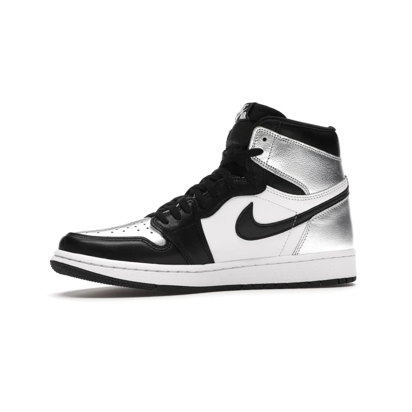 Jordan 1 Retro High Silver Toe (Women's) - Image 17 - Only at www.BallersClubKickz.com - Introducing the Jordan 1 Retro High Silver Toe (Women's): an updated spin on the iconic 'Black Toe' theme. Featuring white & black leather and silver patent leather construction. Nike Air branding, Air Jordan Wings logo, and white/black sole finish give a classic look. The perfect addition to an on-trend streetwear look. Available in classic black & white, this Jordan 1 is an instant classic. Released in February 20