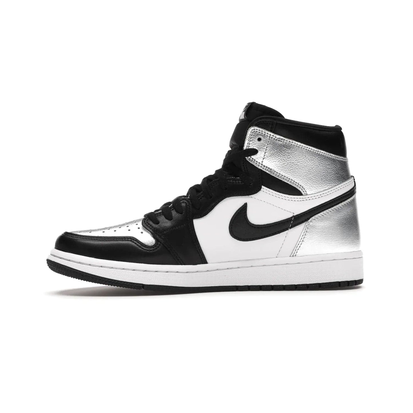 Jordan 1 Retro High Silver Toe (Women's) - Image 18 - Only at www.BallersClubKickz.com - Introducing the Jordan 1 Retro High Silver Toe (Women's): an updated spin on the iconic 'Black Toe' theme. Featuring white & black leather and silver patent leather construction. Nike Air branding, Air Jordan Wings logo, and white/black sole finish give a classic look. The perfect addition to an on-trend streetwear look. Available in classic black & white, this Jordan 1 is an instant classic. Released in February 20