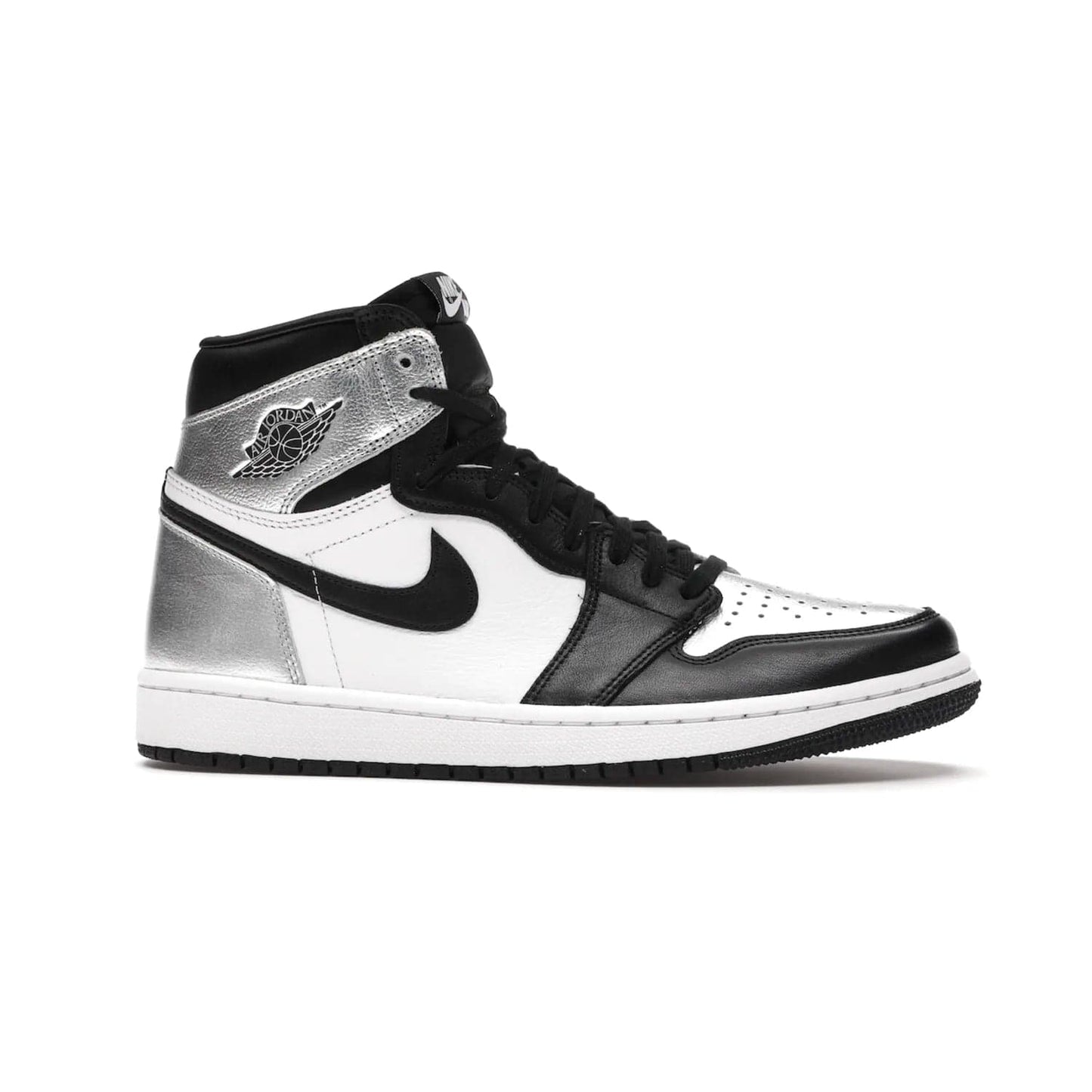Jordan 1 Retro High Silver Toe (Women's) - Image 2 - Only at www.BallersClubKickz.com - Introducing the Jordan 1 Retro High Silver Toe (Women's): an updated spin on the iconic 'Black Toe' theme. Featuring white & black leather and silver patent leather construction. Nike Air branding, Air Jordan Wings logo, and white/black sole finish give a classic look. The perfect addition to an on-trend streetwear look. Available in classic black & white, this Jordan 1 is an instant classic. Released in February 202