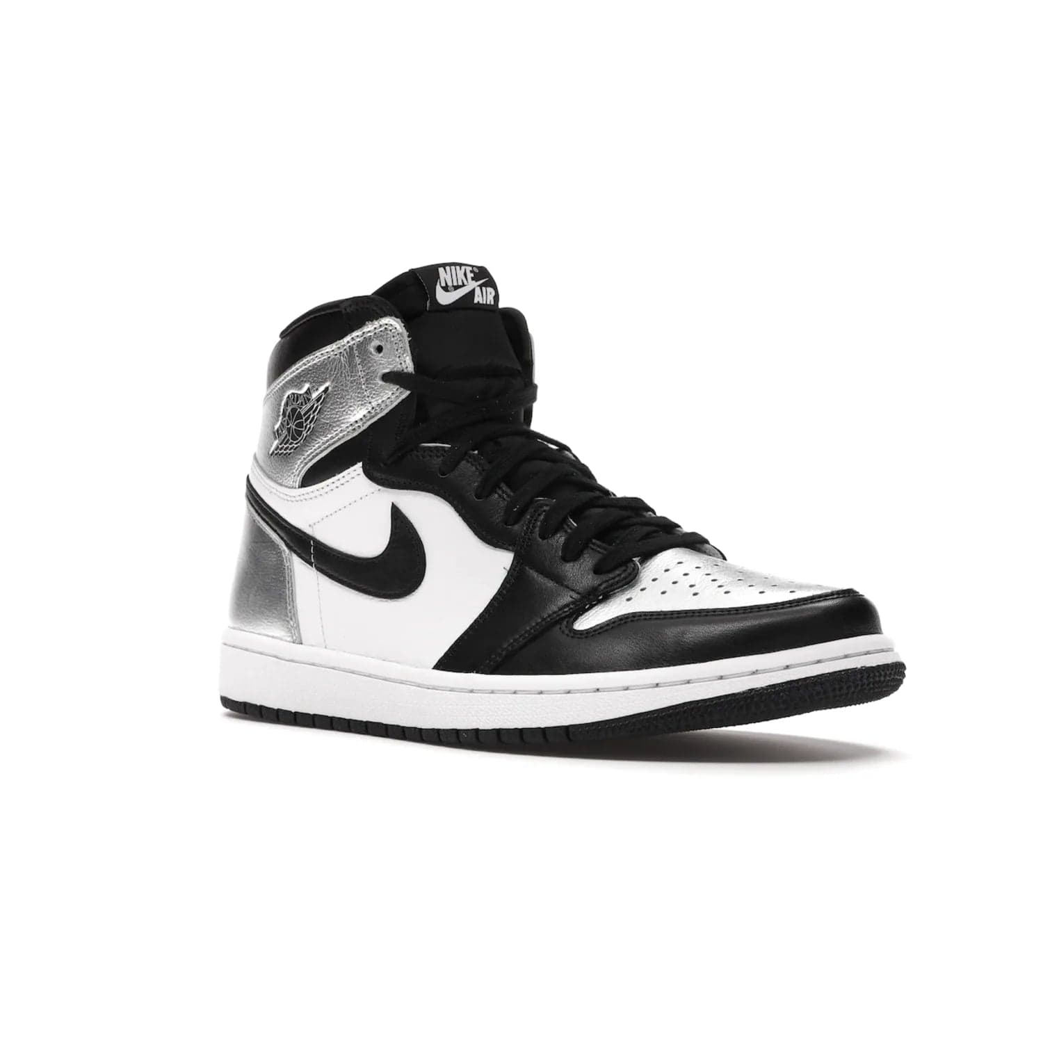 Jordan 1 Retro High Silver Toe (Women's) - Image 5 - Only at www.BallersClubKickz.com - Introducing the Jordan 1 Retro High Silver Toe (Women's): an updated spin on the iconic 'Black Toe' theme. Featuring white & black leather and silver patent leather construction. Nike Air branding, Air Jordan Wings logo, and white/black sole finish give a classic look. The perfect addition to an on-trend streetwear look. Available in classic black & white, this Jordan 1 is an instant classic. Released in February 202