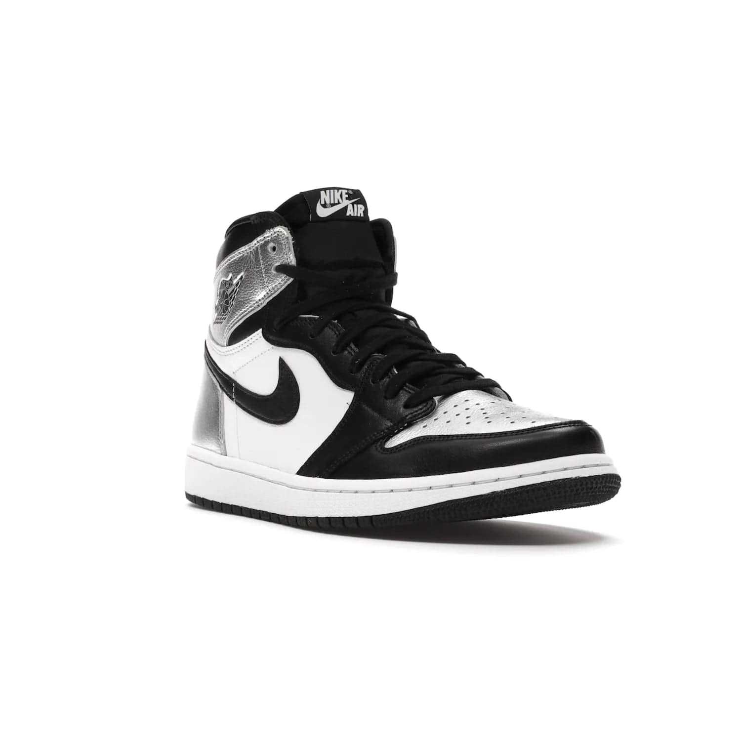 Jordan 1 Retro High Silver Toe (Women's) - Image 6 - Only at www.BallersClubKickz.com - Introducing the Jordan 1 Retro High Silver Toe (Women's): an updated spin on the iconic 'Black Toe' theme. Featuring white & black leather and silver patent leather construction. Nike Air branding, Air Jordan Wings logo, and white/black sole finish give a classic look. The perfect addition to an on-trend streetwear look. Available in classic black & white, this Jordan 1 is an instant classic. Released in February 202