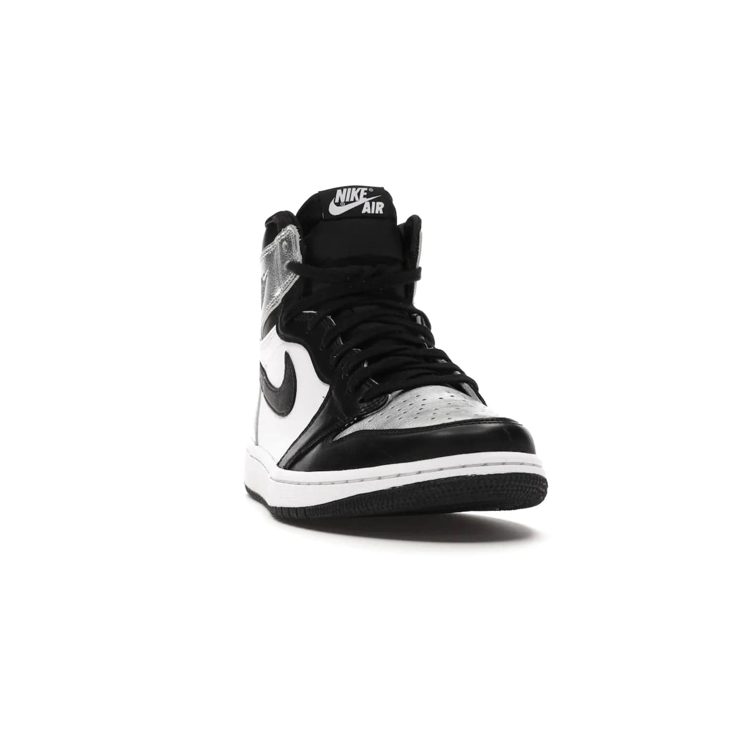 Jordan 1 Retro High Silver Toe (Women's) - Image 8 - Only at www.BallersClubKickz.com - Introducing the Jordan 1 Retro High Silver Toe (Women's): an updated spin on the iconic 'Black Toe' theme. Featuring white & black leather and silver patent leather construction. Nike Air branding, Air Jordan Wings logo, and white/black sole finish give a classic look. The perfect addition to an on-trend streetwear look. Available in classic black & white, this Jordan 1 is an instant classic. Released in February 202