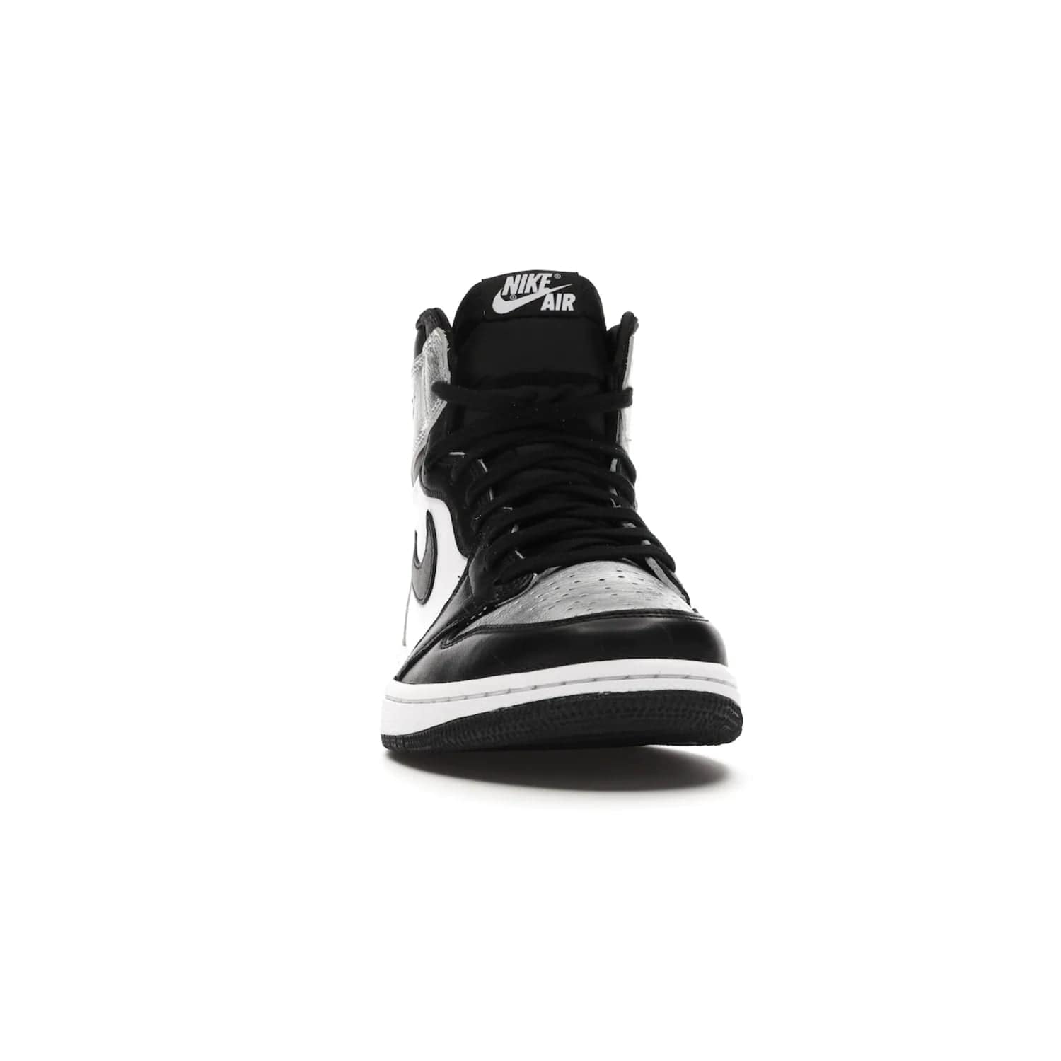 Jordan 1 Retro High Silver Toe (Women's) - Image 9 - Only at www.BallersClubKickz.com - Introducing the Jordan 1 Retro High Silver Toe (Women's): an updated spin on the iconic 'Black Toe' theme. Featuring white & black leather and silver patent leather construction. Nike Air branding, Air Jordan Wings logo, and white/black sole finish give a classic look. The perfect addition to an on-trend streetwear look. Available in classic black & white, this Jordan 1 is an instant classic. Released in February 202