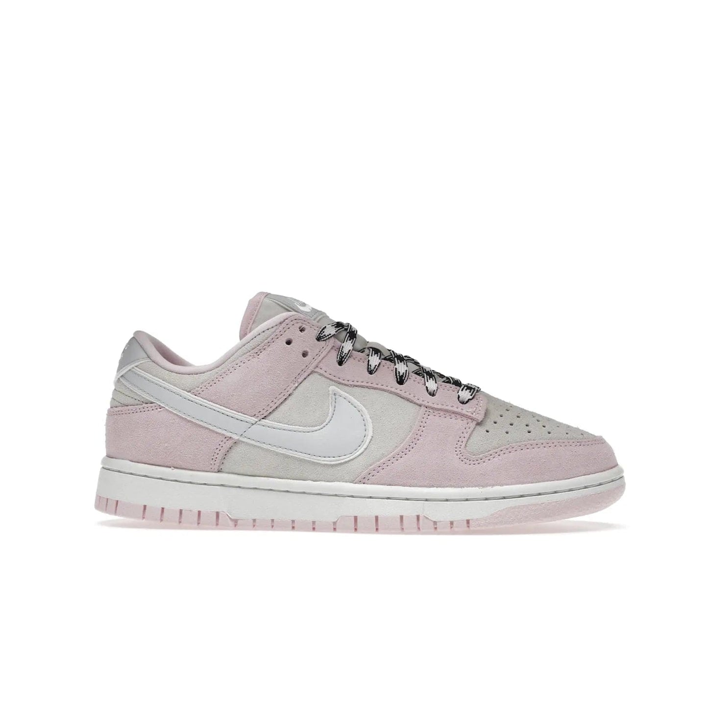 Nike Dunk Low LX Pink Foam (Women's) - Image 2 - Only at www.BallersClubKickz.com - Feminine & fashionable Nike Dunk Low LX Pink Foam W sneaker. Featuring leather and synthetic materials and durable rubber sole. Lace-up design ensures a snug fit. Released Dec. 10th 2022, $120. Stylish and comfortable.