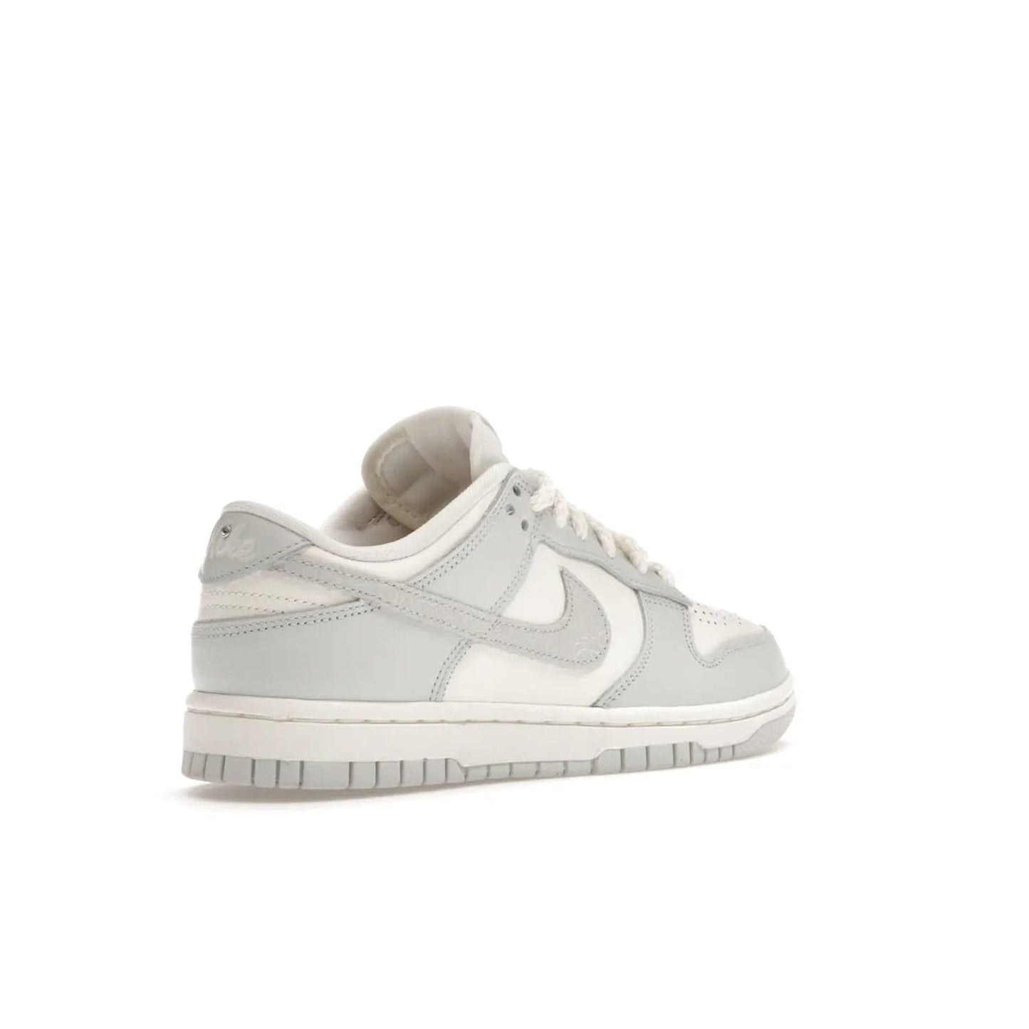 Nike Dunk Low Needlework Sail Aura (Women's) - Image 33 - Only at www.BallersClubKickz.com - Discover the Nike Dunk Low Needlework Sail Aura for Women. Boasting a beautiful Sail and Neutral Grey upper, this stylish sneaker offers durable materials with ultra-soft cushioning for all-day comfort. Get your pair today!