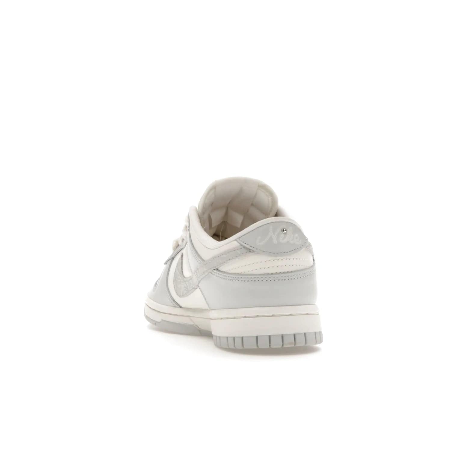 Nike Dunk Low Needlework Sail Aura (Women's) - Image 26 - Only at www.BallersClubKickz.com - Discover the Nike Dunk Low Needlework Sail Aura for Women. Boasting a beautiful Sail and Neutral Grey upper, this stylish sneaker offers durable materials with ultra-soft cushioning for all-day comfort. Get your pair today!
