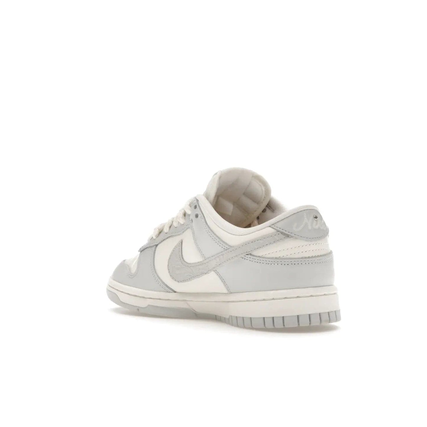 Nike Dunk Low Needlework Sail Aura (Women's) - Image 24 - Only at www.BallersClubKickz.com - Discover the Nike Dunk Low Needlework Sail Aura for Women. Boasting a beautiful Sail and Neutral Grey upper, this stylish sneaker offers durable materials with ultra-soft cushioning for all-day comfort. Get your pair today!