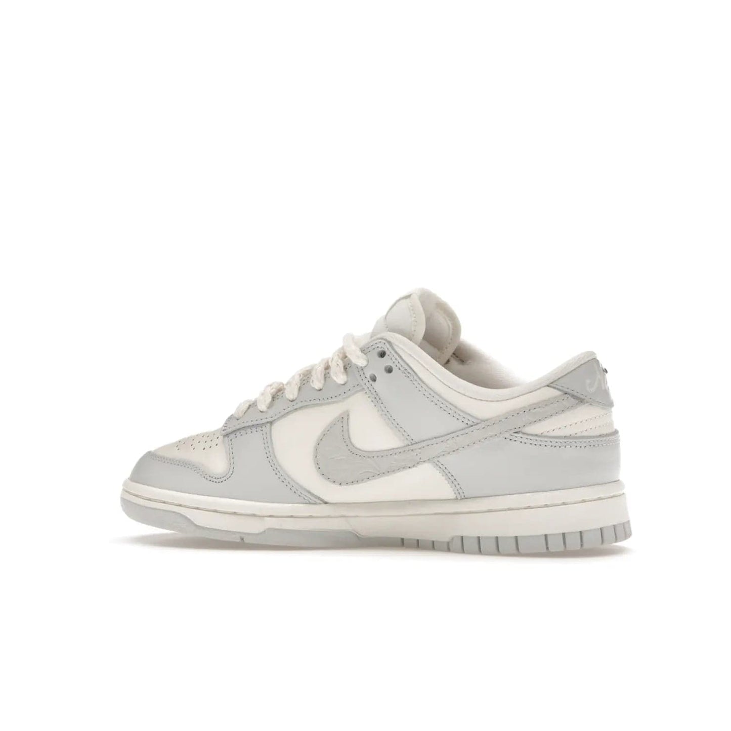 Nike Dunk Low Needlework Sail Aura (Women's) - Image 21 - Only at www.BallersClubKickz.com - Discover the Nike Dunk Low Needlework Sail Aura for Women. Boasting a beautiful Sail and Neutral Grey upper, this stylish sneaker offers durable materials with ultra-soft cushioning for all-day comfort. Get your pair today!