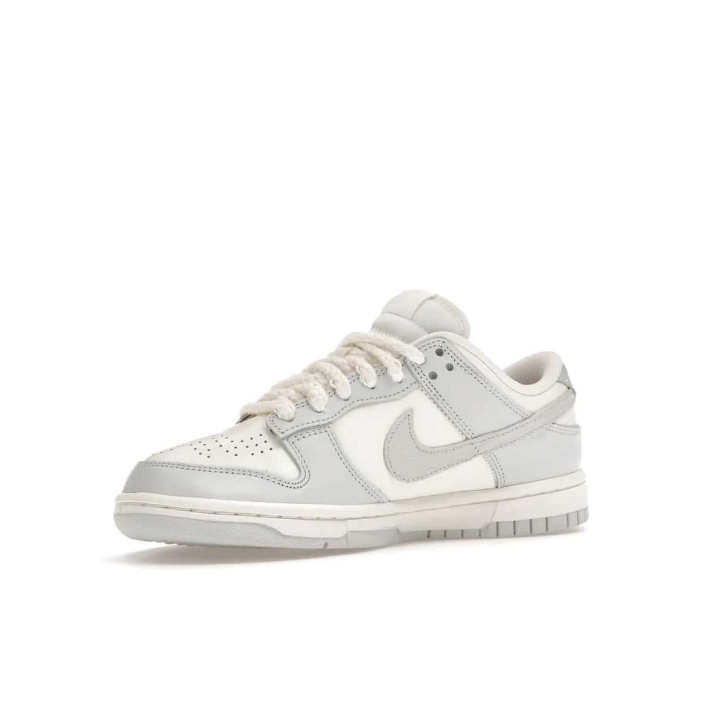 Nike Dunk Low Needlework Sail Aura (Women's) - Image 16 - Only at www.BallersClubKickz.com - Discover the Nike Dunk Low Needlework Sail Aura for Women. Boasting a beautiful Sail and Neutral Grey upper, this stylish sneaker offers durable materials with ultra-soft cushioning for all-day comfort. Get your pair today!
