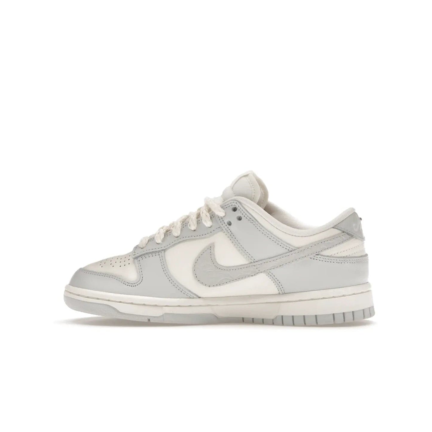 Nike Dunk Low Needlework Sail Aura (Women's) - Image 20 - Only at www.BallersClubKickz.com - Discover the Nike Dunk Low Needlework Sail Aura for Women. Boasting a beautiful Sail and Neutral Grey upper, this stylish sneaker offers durable materials with ultra-soft cushioning for all-day comfort. Get your pair today!
