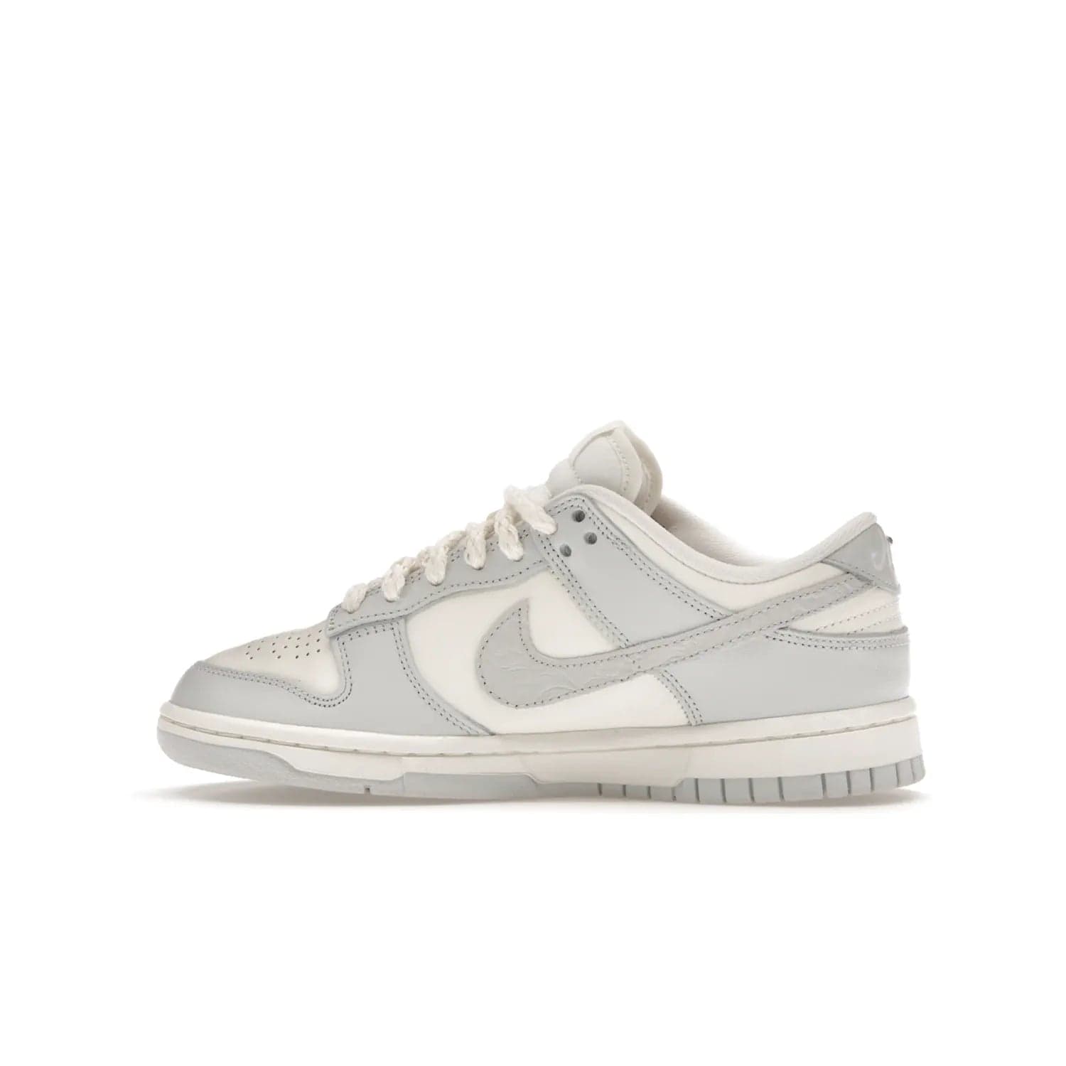 Nike Dunk Low Needlework Sail Aura (Women's) - Image 20 - Only at www.BallersClubKickz.com - Discover the Nike Dunk Low Needlework Sail Aura for Women. Boasting a beautiful Sail and Neutral Grey upper, this stylish sneaker offers durable materials with ultra-soft cushioning for all-day comfort. Get your pair today!